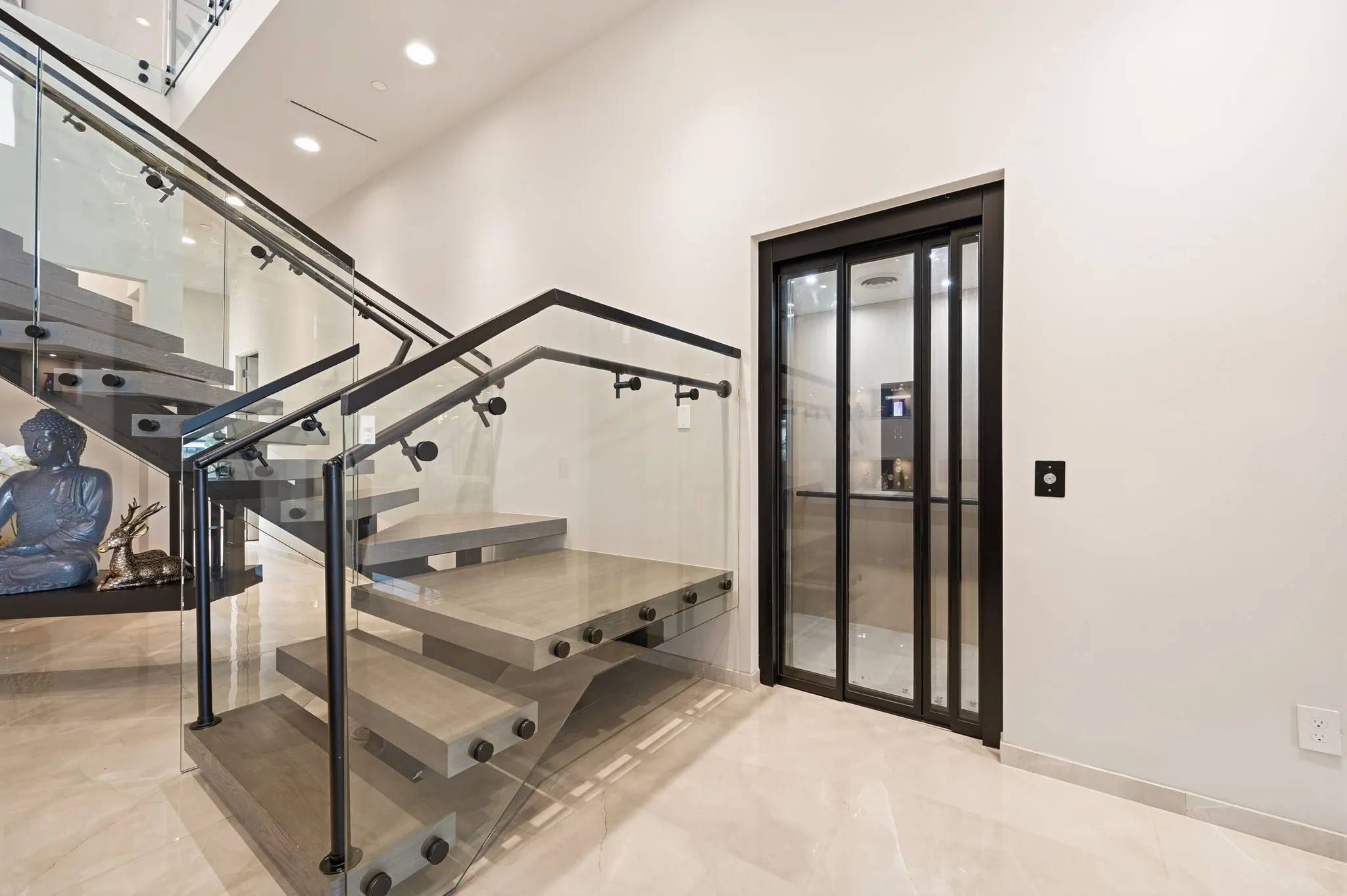 Statement floating staircase creating a dramatic architectural focal point.