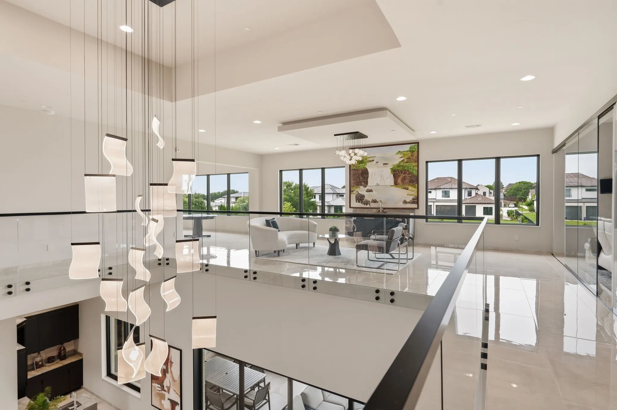 Gallery style overlook highlighting soaring ceilings and open architectural design.