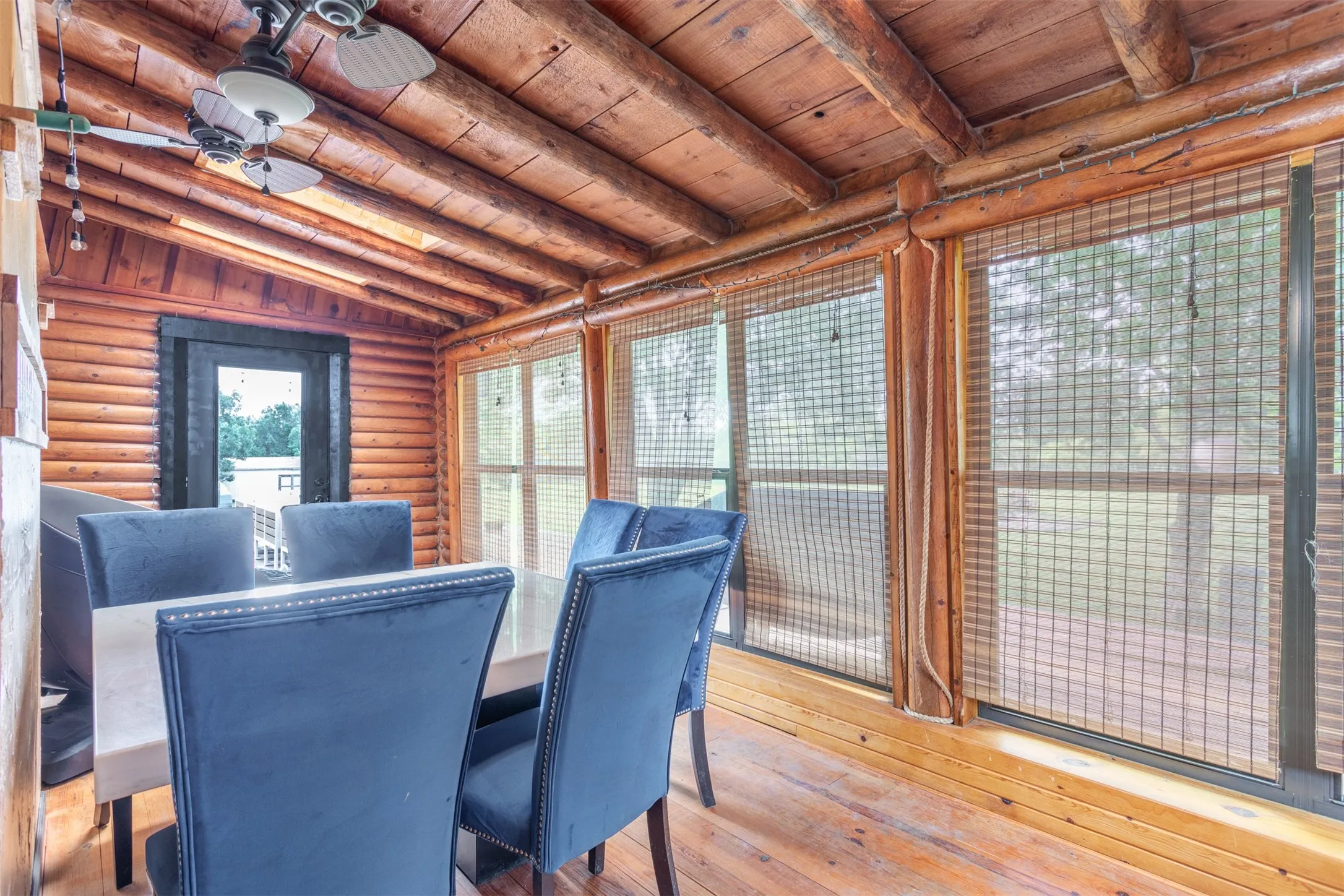 Sunroom has lots of natural light and 2 doors to the deck