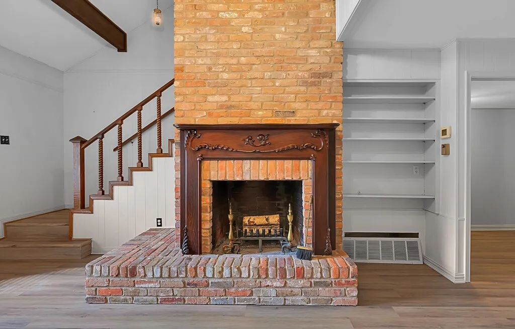 Two Story Brick Wood-Burning Fireplace in Valted Family Room