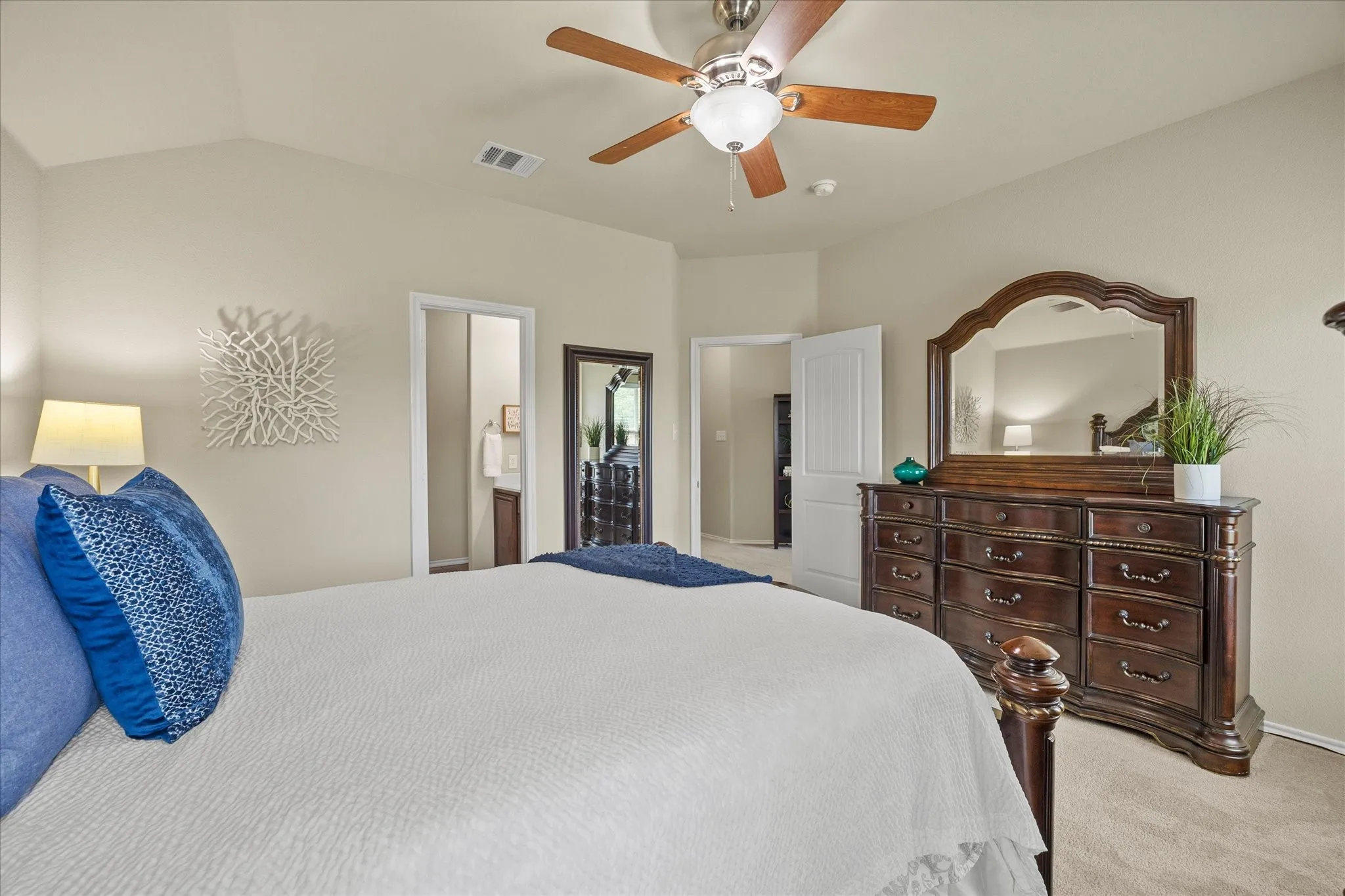 Bedroom featuring vaulted ceilings and neutral wall tones