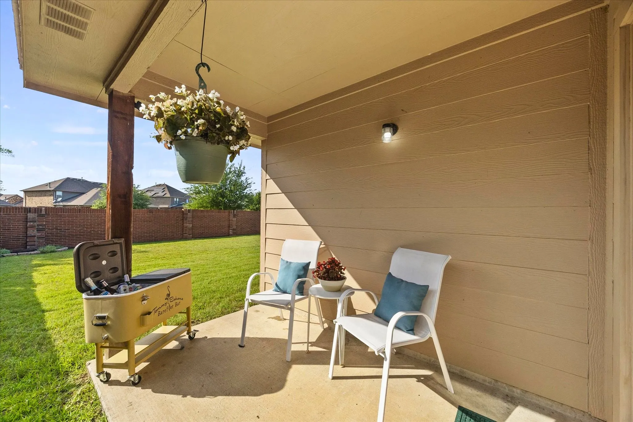 Covered patio featuring a concrete slab and wood-finish support column