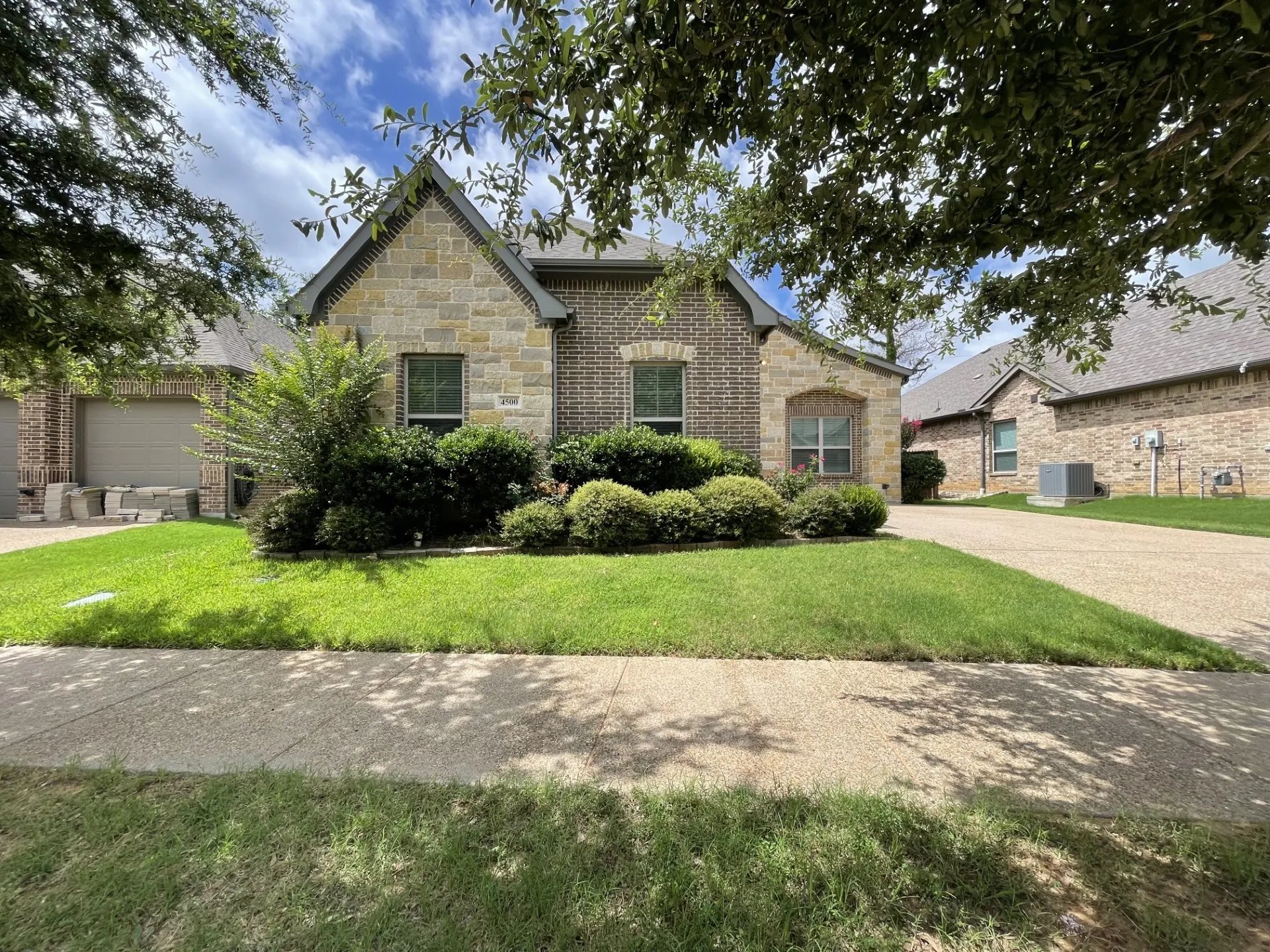Stone and brick facade with gabled roofline