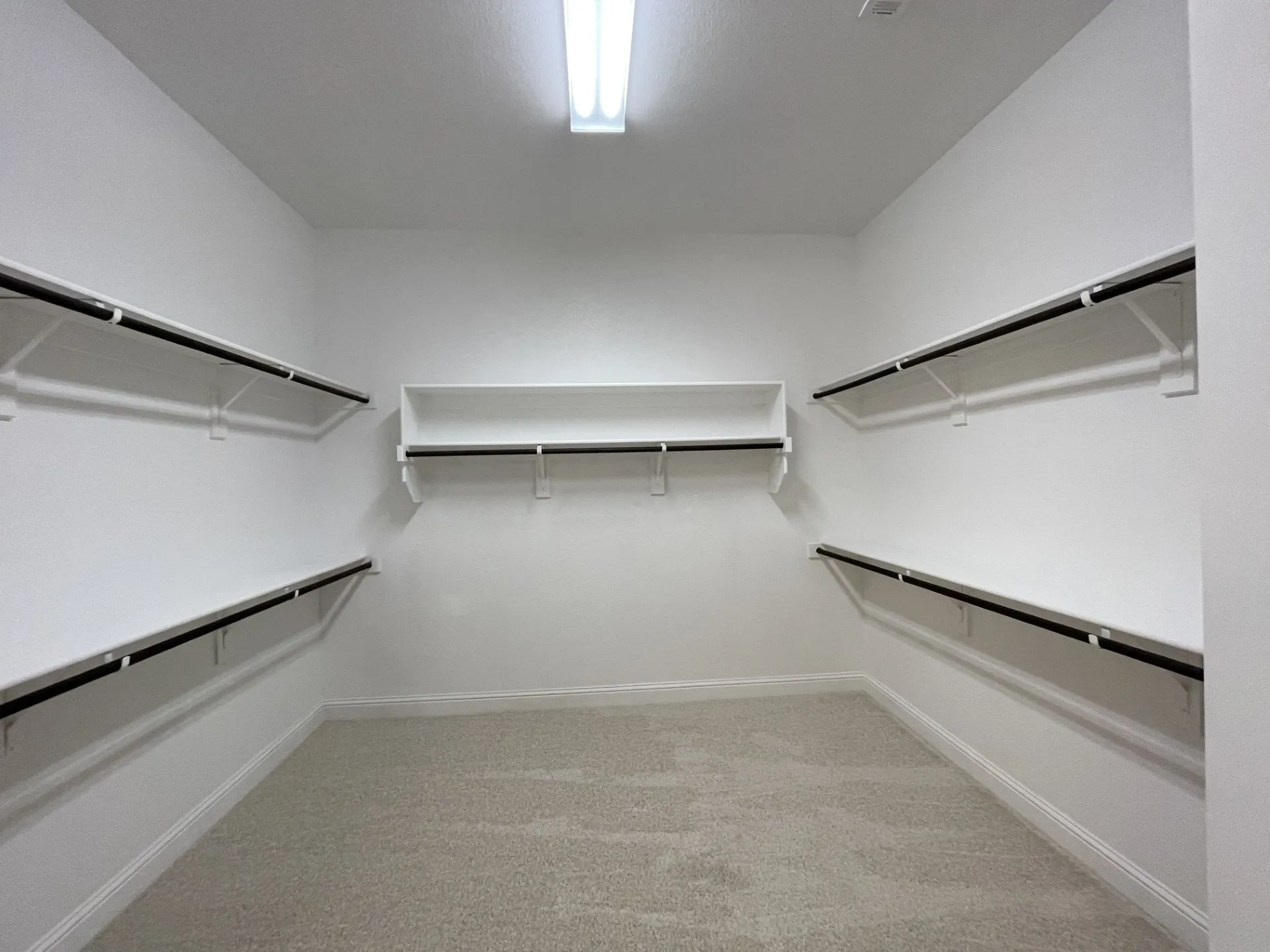 White painted walls with light beige carpeting