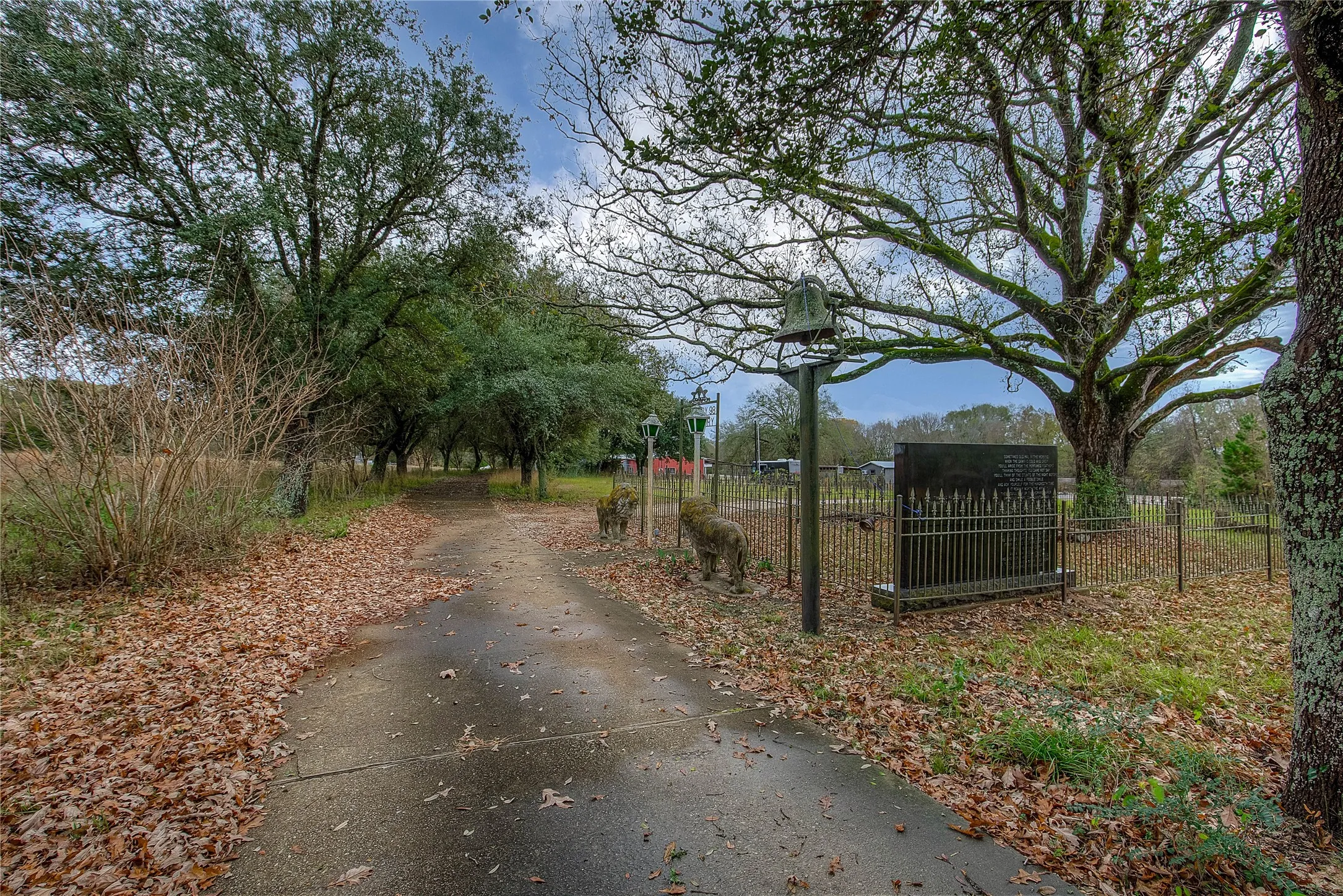 Drive way into property. Small cemetery on property