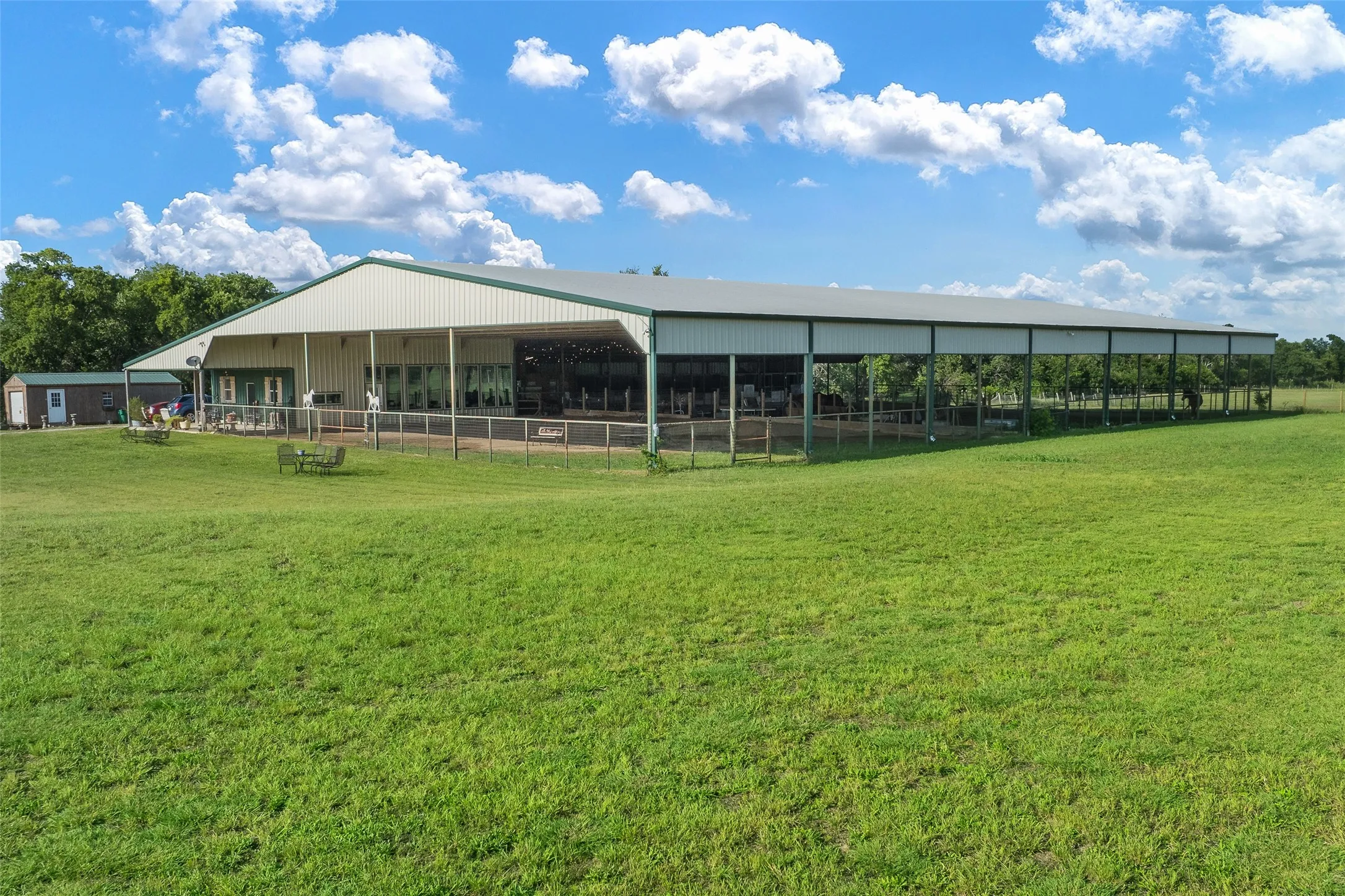 Covered arena with living area and stalls