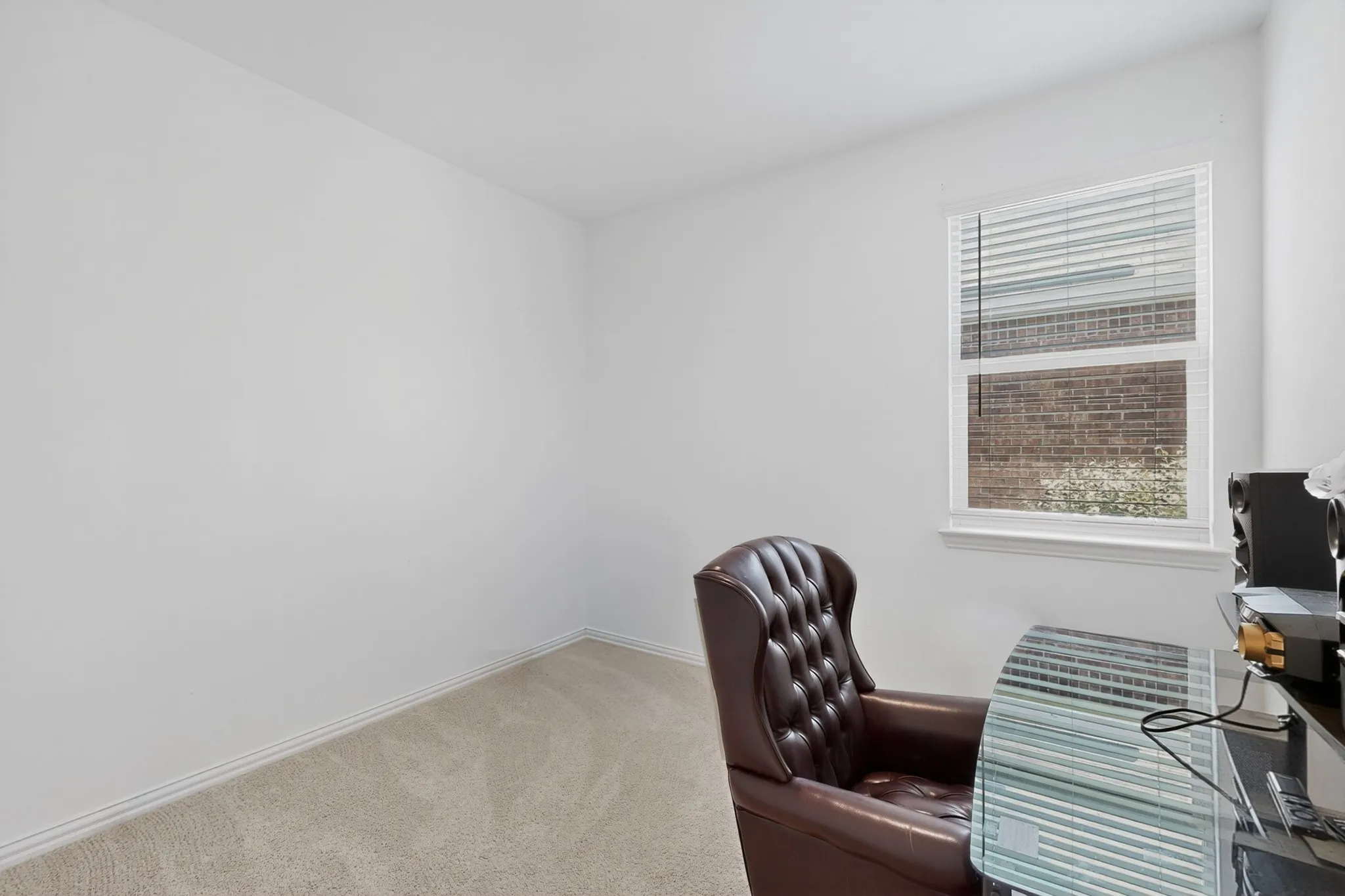 Room featuring light-toned carpeting and white walls