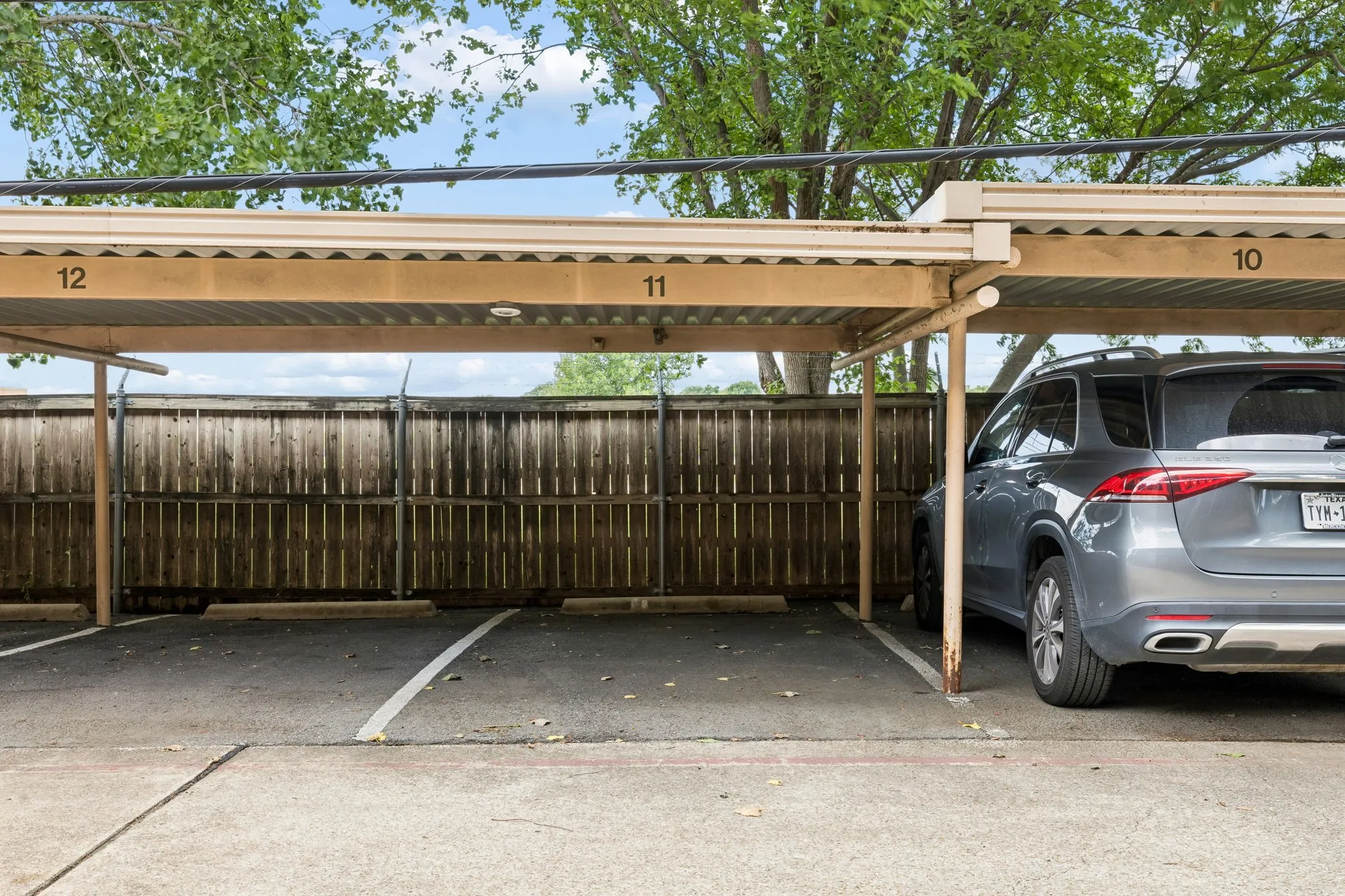 Reserved parking spot is covered by a private carport just steps from your door.
