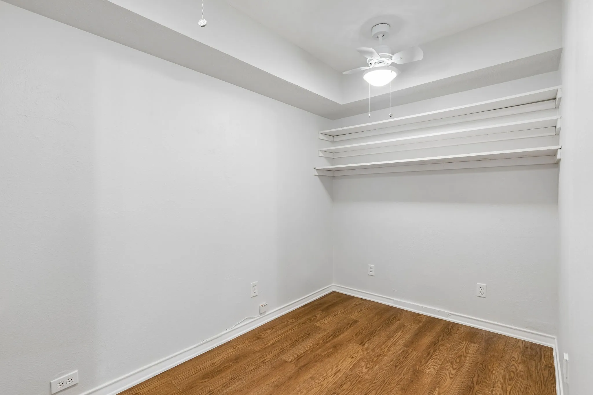 Versatile bonus room off the primary bedroom offers space for an office, extra storage, or the option to relocate laundry.