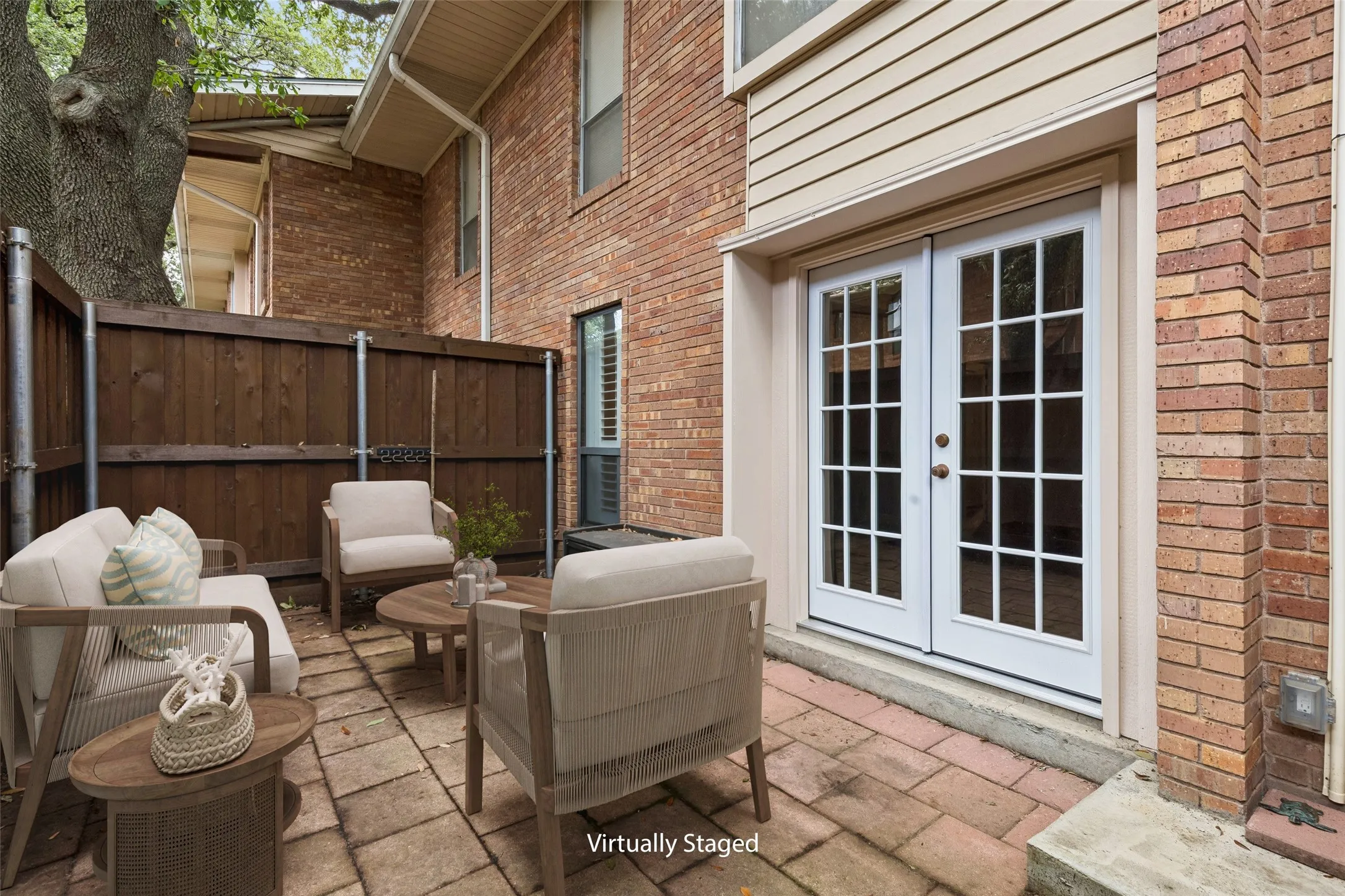 Private, fenced patio offers a peaceful spot for morning coffee or evening relaxation.