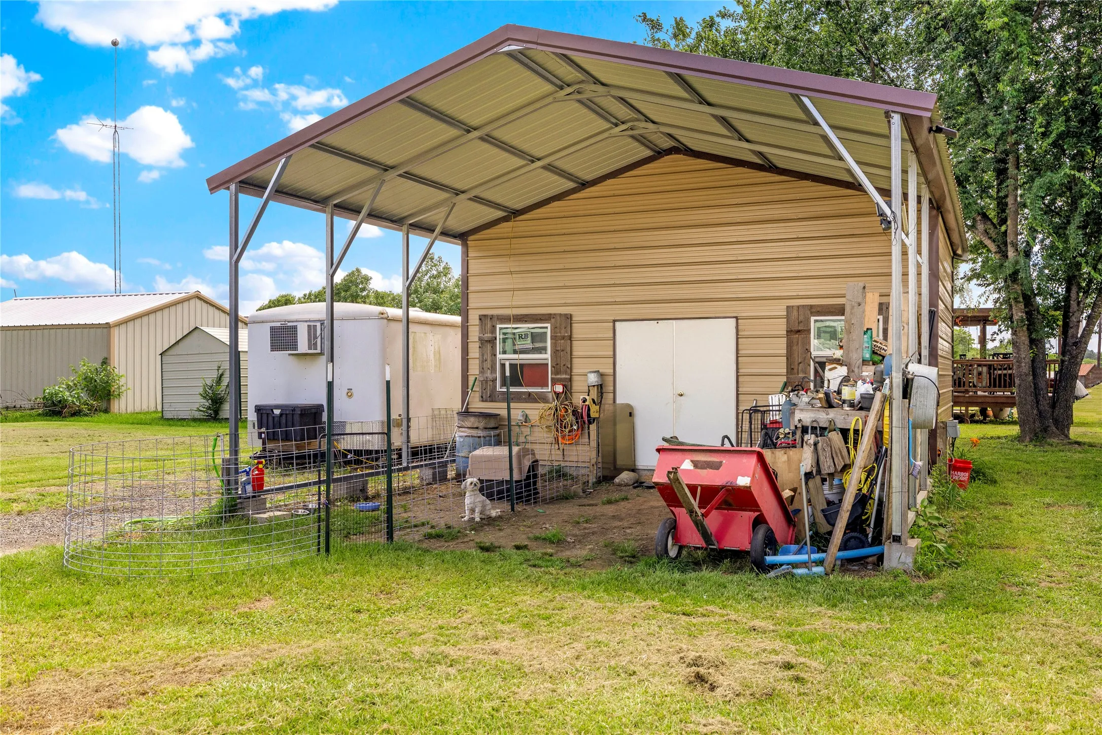 Workshop with concrete floor and it's own Electric meter with carport