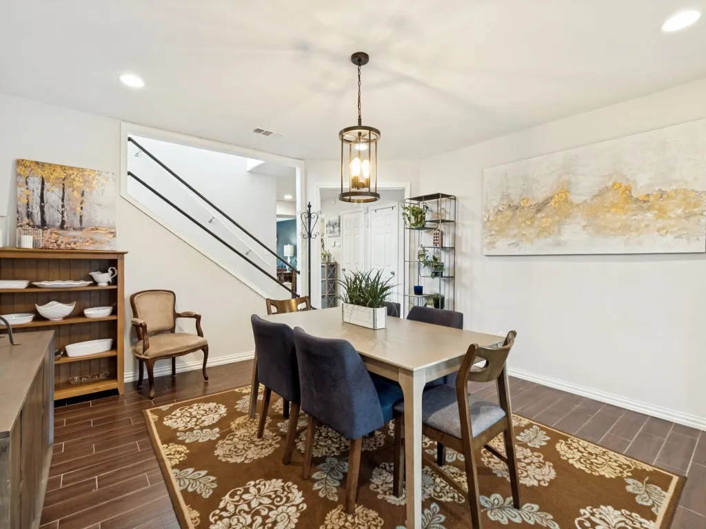 Spacious dining area perfect for entertaining or family gatherings, featuring direct French door access to the front patio.