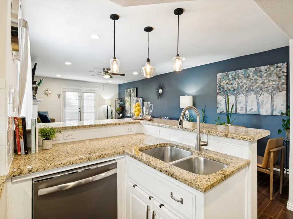 Gorgeous kitchen with granite counters, built-in cabinets, and a huge walk-in pantry.