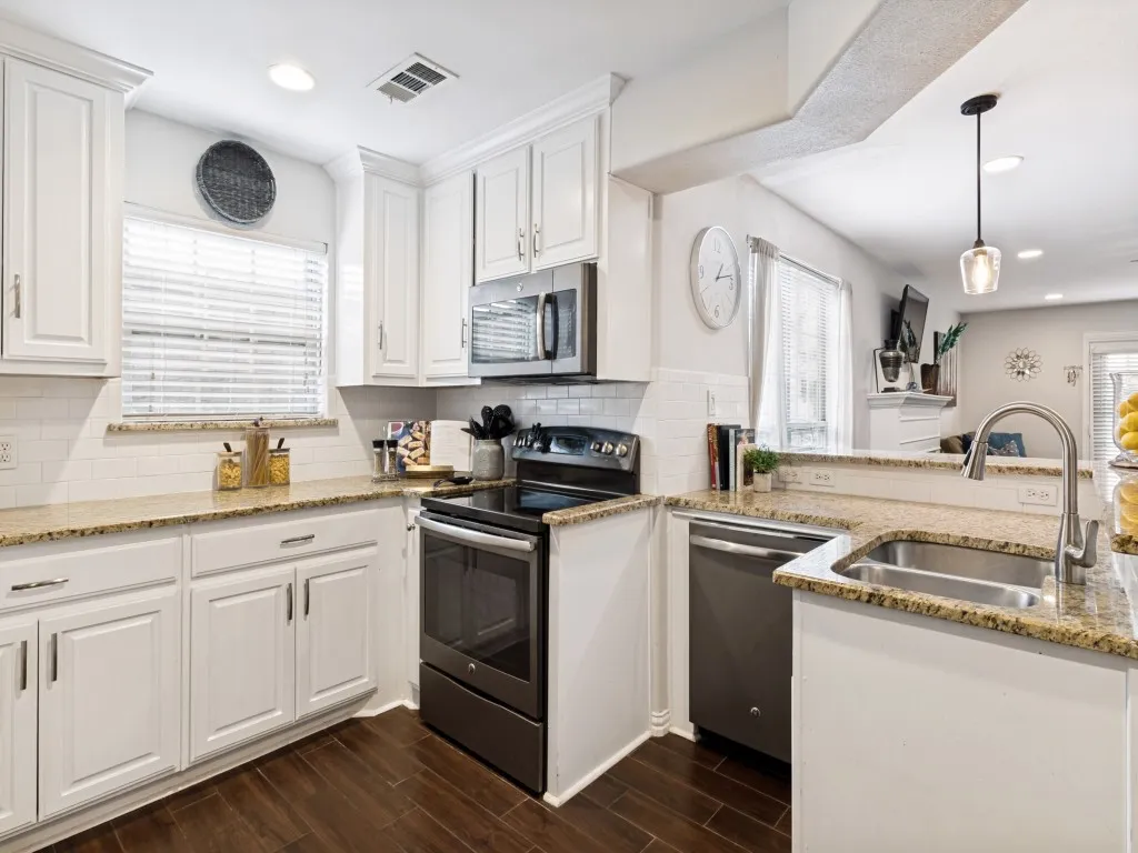 Gorgeous kitchen with granite counters, built-in cabinets, and a huge walk-in pantry.