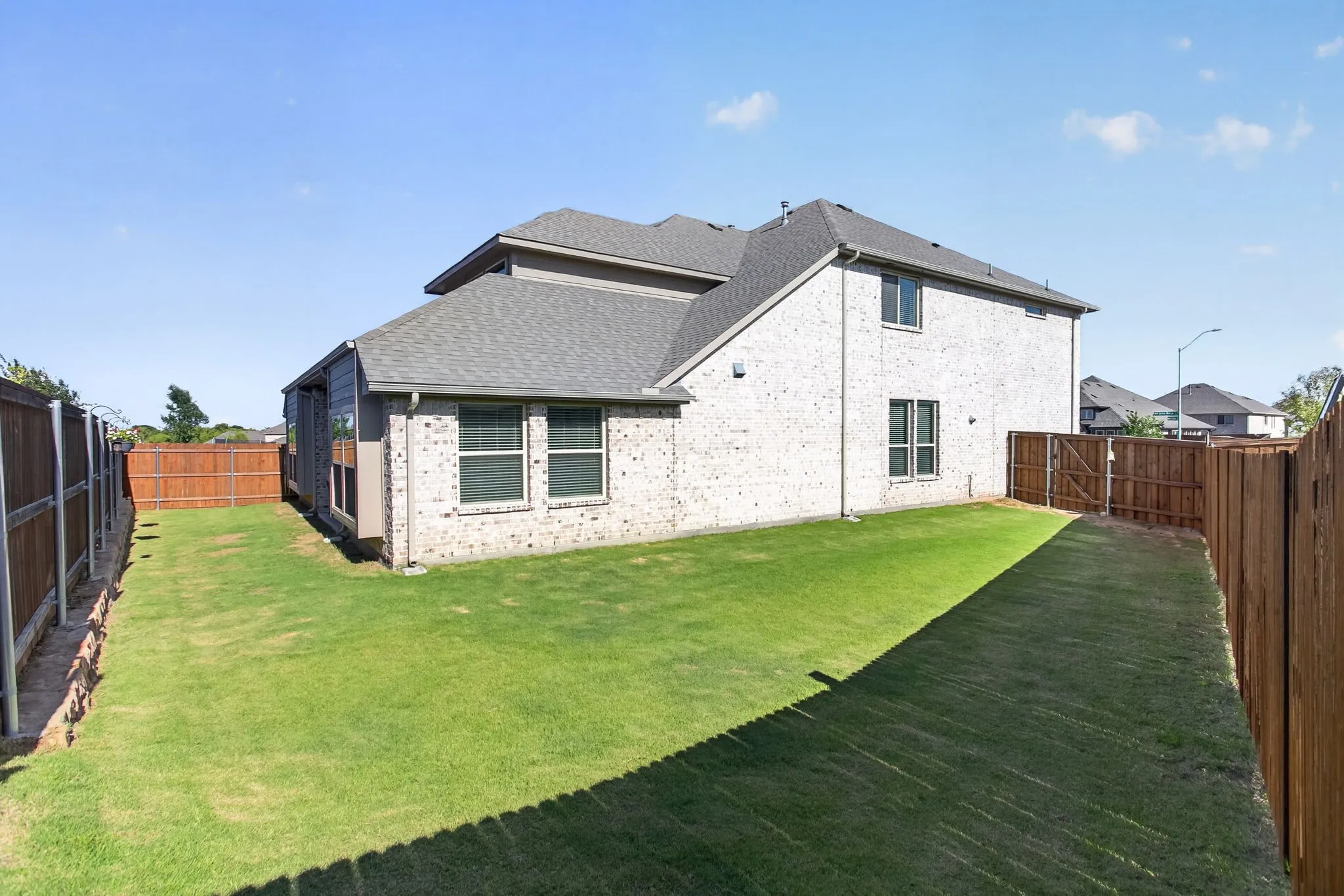 Tons of side yard for space to play - and don't forget all of the amenities and green spaces just beyond your front door.