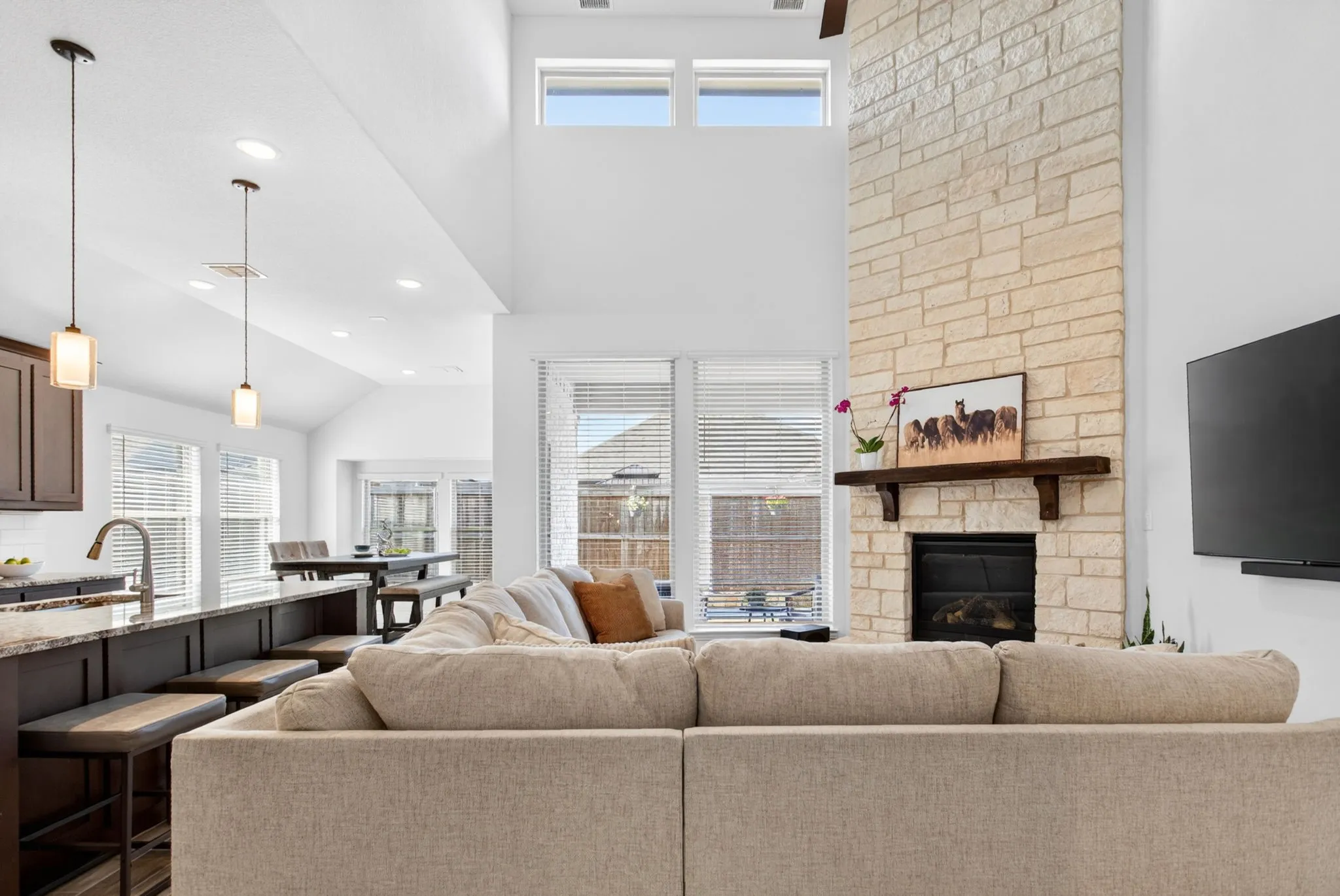 The gas fireplace is incredible. Stone all the way to the ceiling, and the perfect wood mantel.