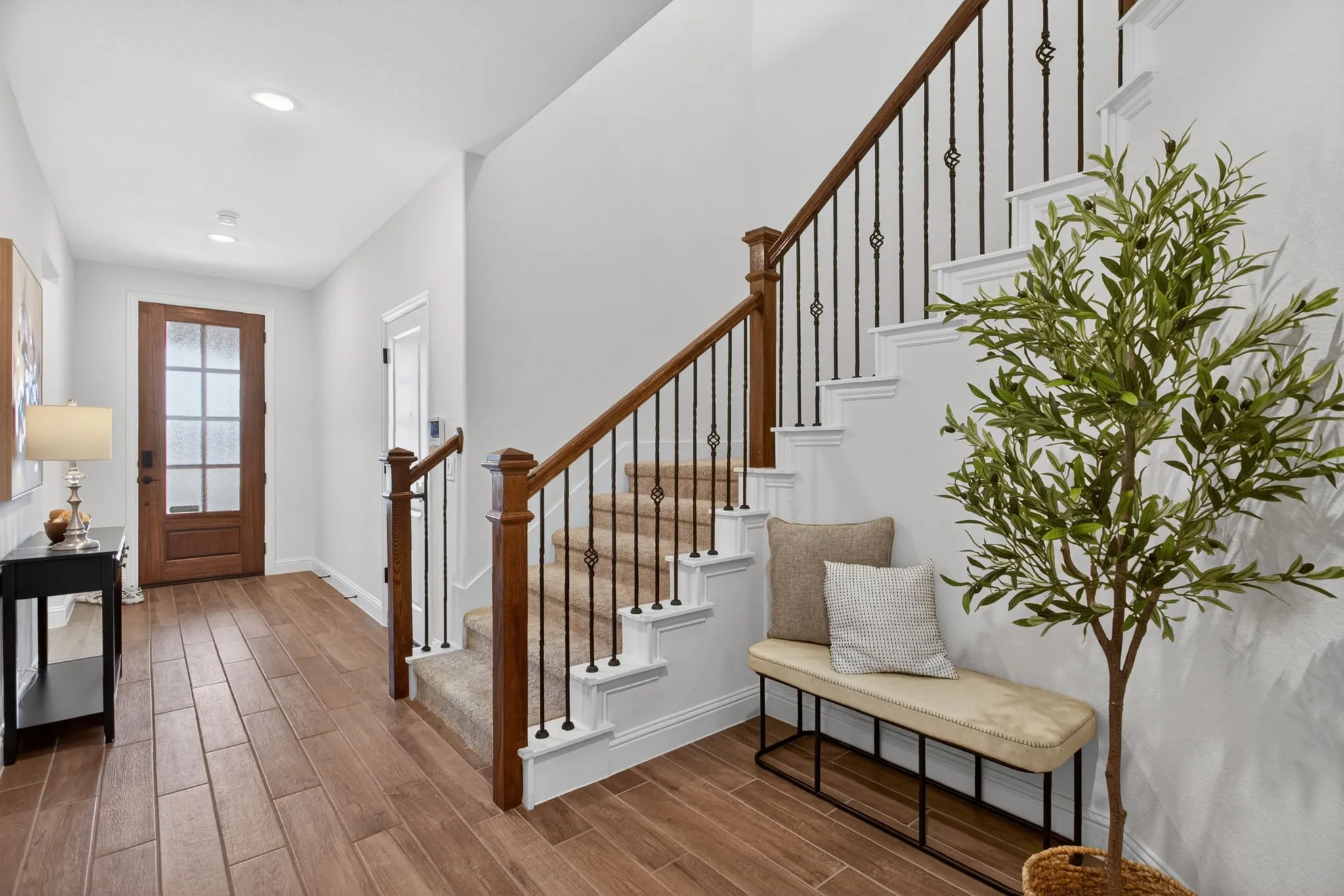 Entryway is so welcoming - wide foyer with niche area for a drop zone. Garage at front right.