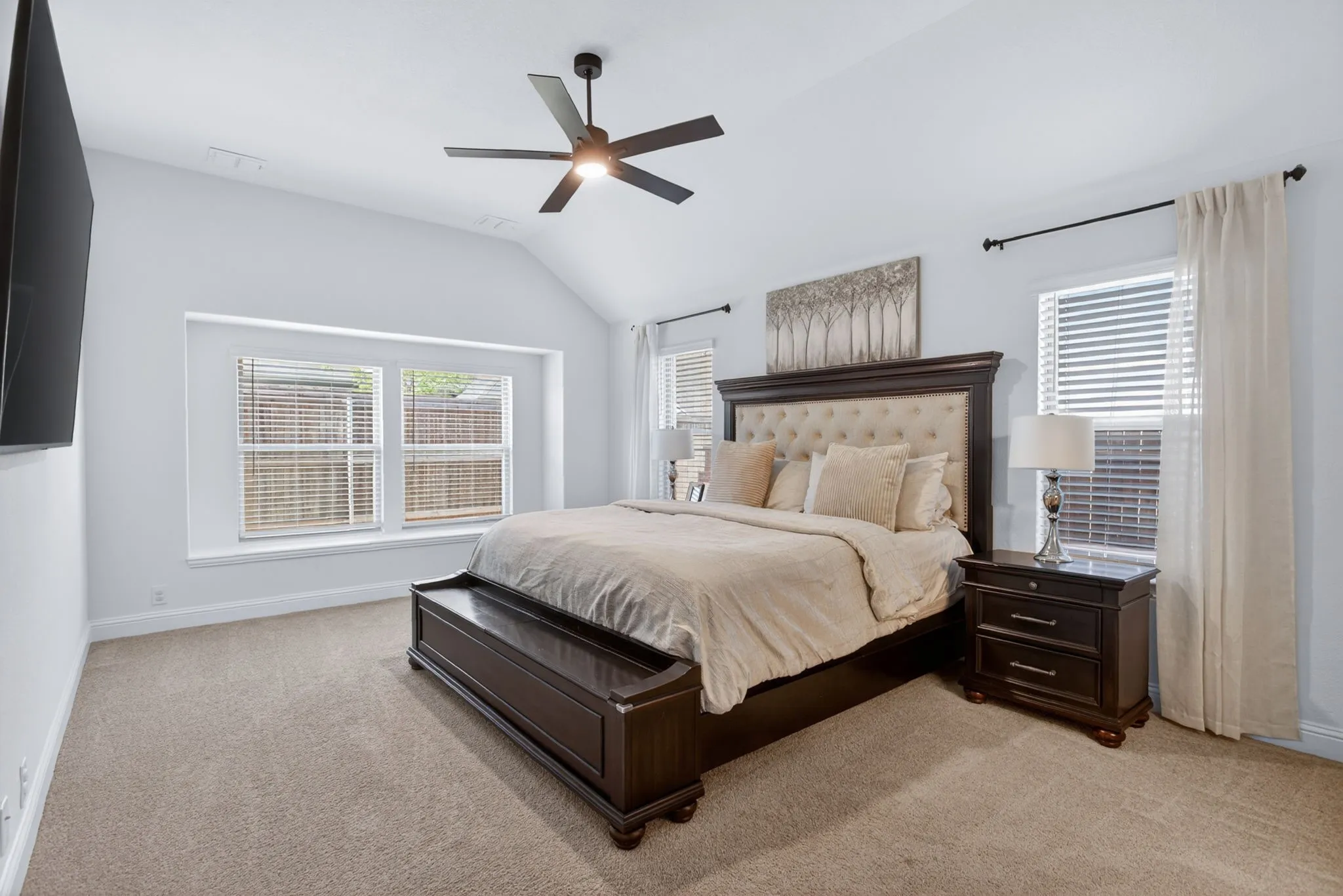 Primary bedroom is spacious and serene.