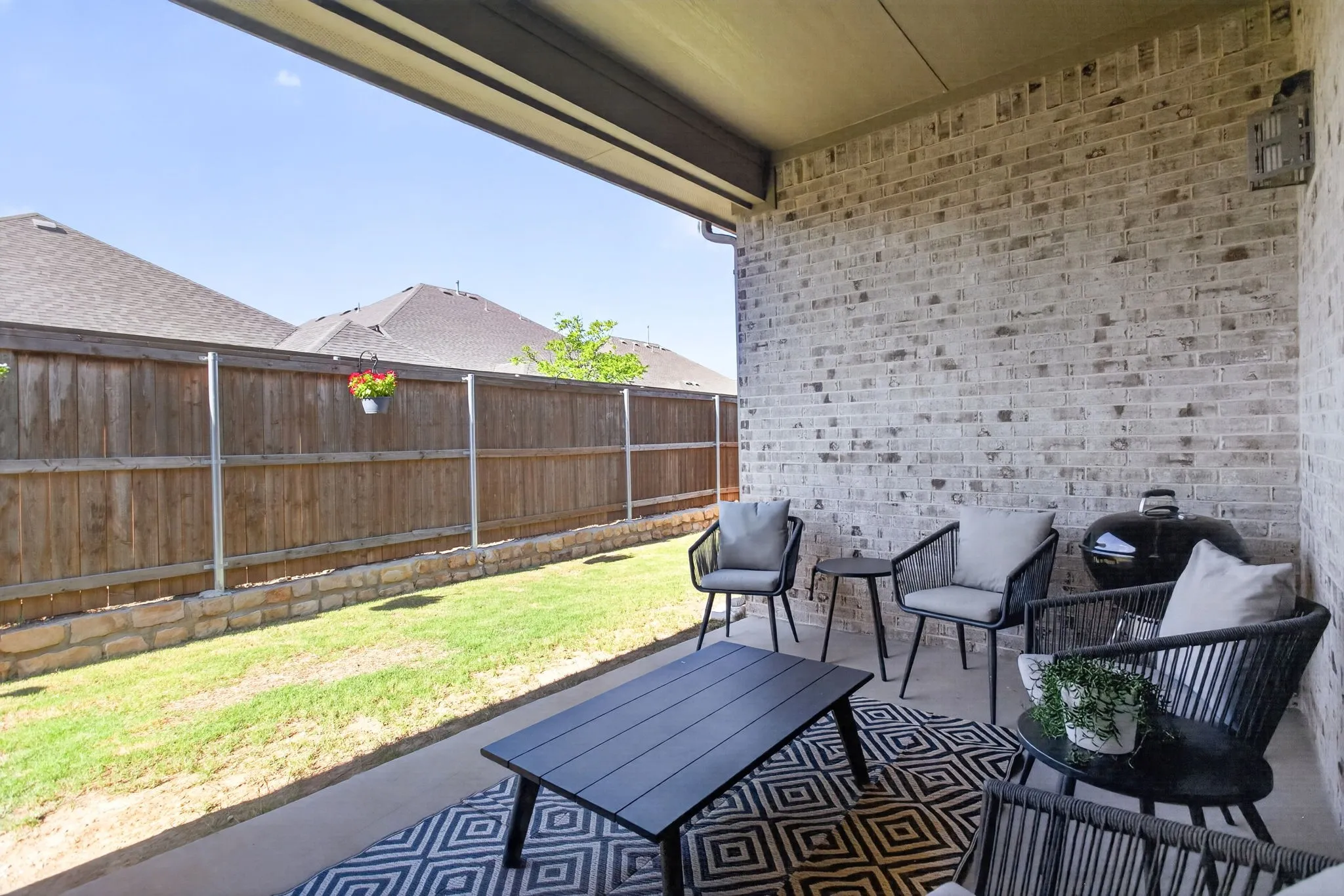 Good-sized covered back porch for hanging out.
