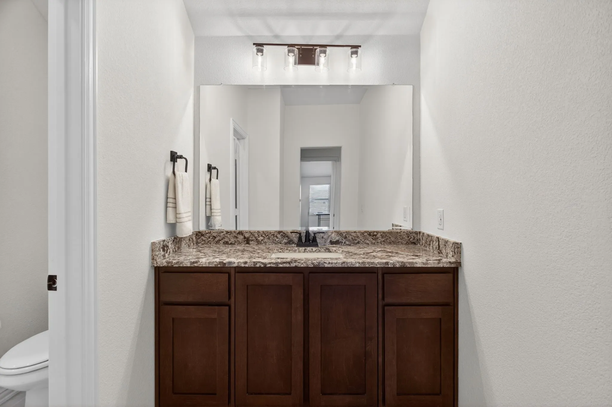 Both sides have big vanity spaces. No more fighting!