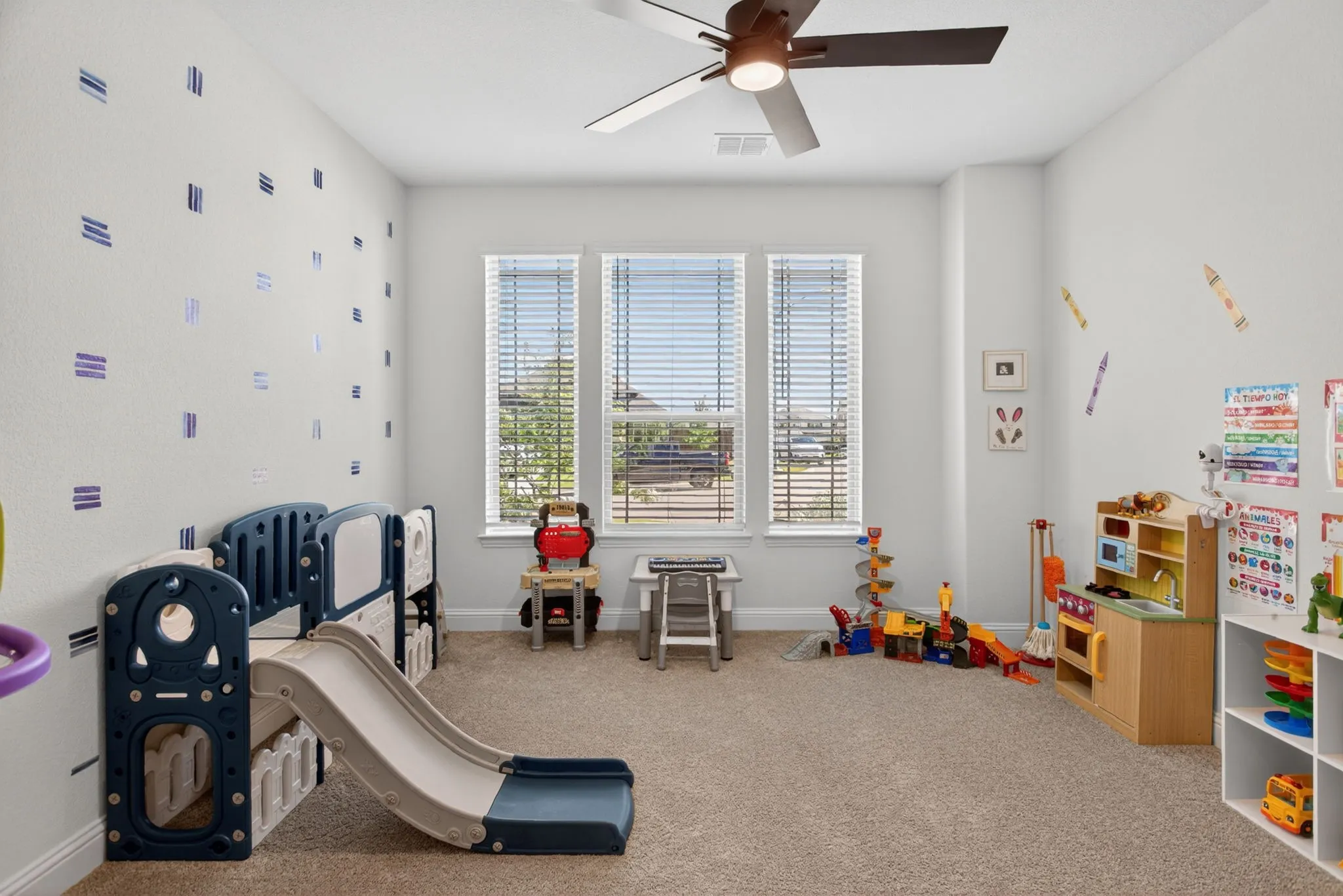 Downstairs guest bedroom is being used as a playroom; perfect for a nursery or MIL suite.