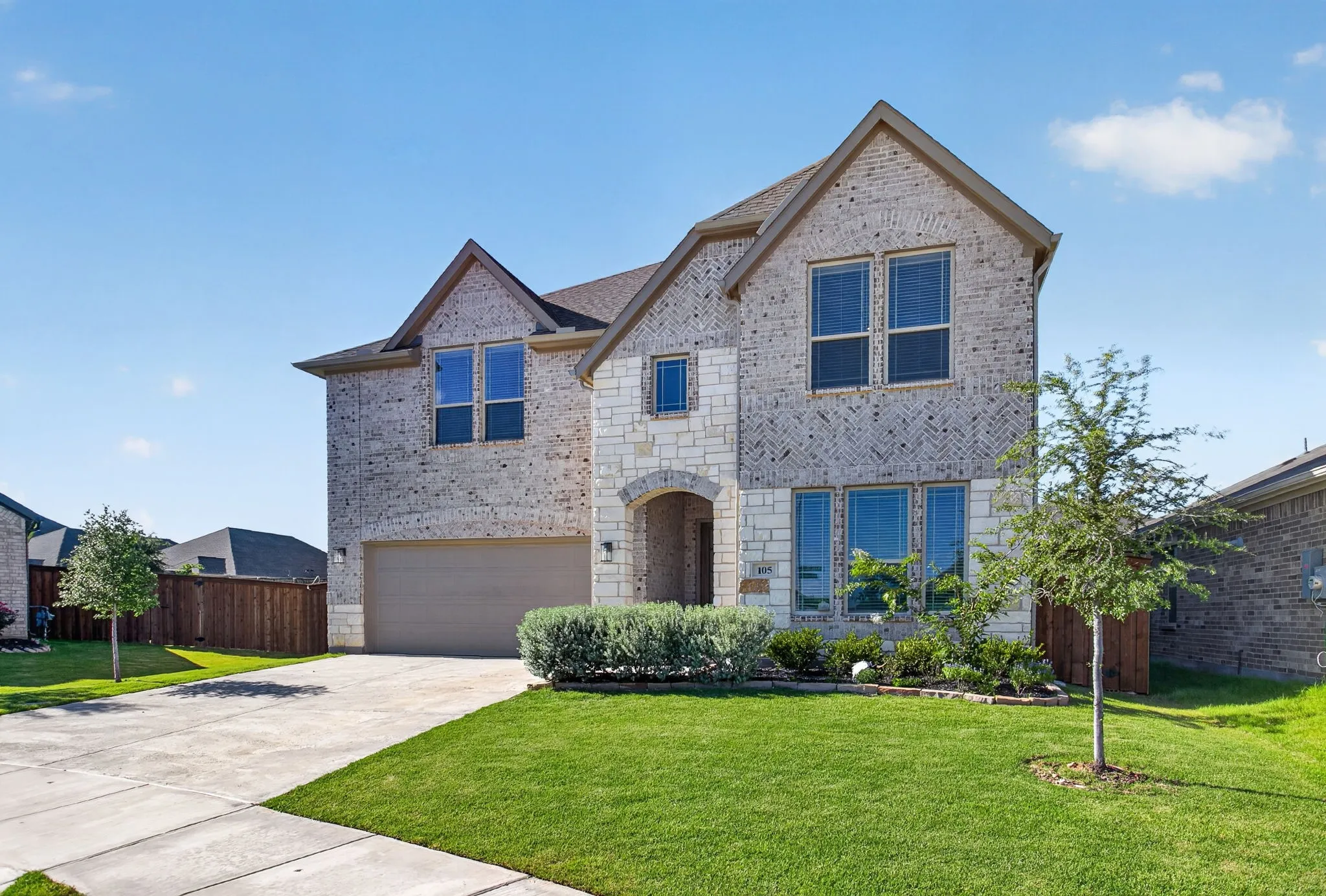 Beautifully maintained yard and knock-out curb appeal on a half cul-de-sac turn.