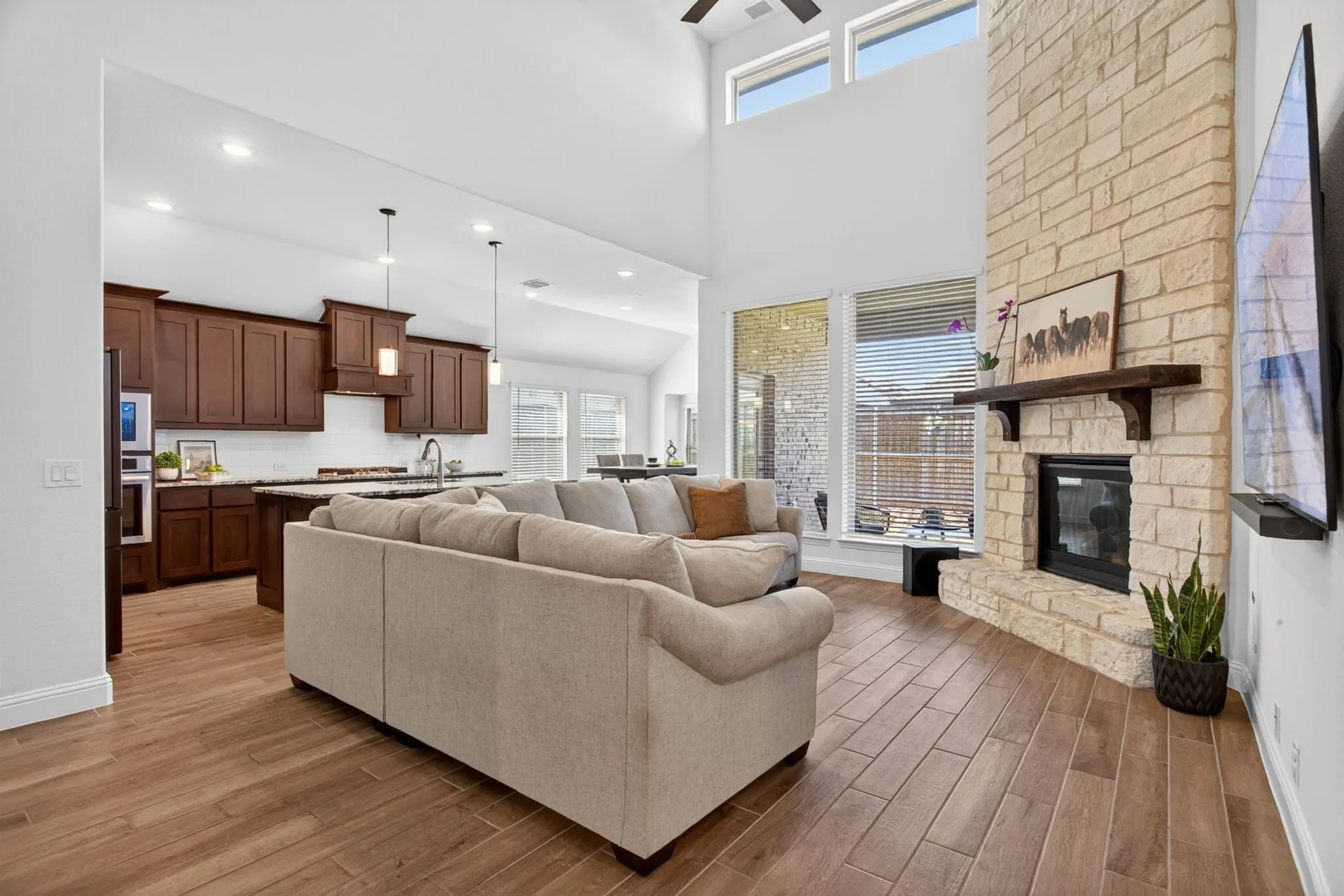 Living room is so airy with soaring ceilings and tons of natural light.