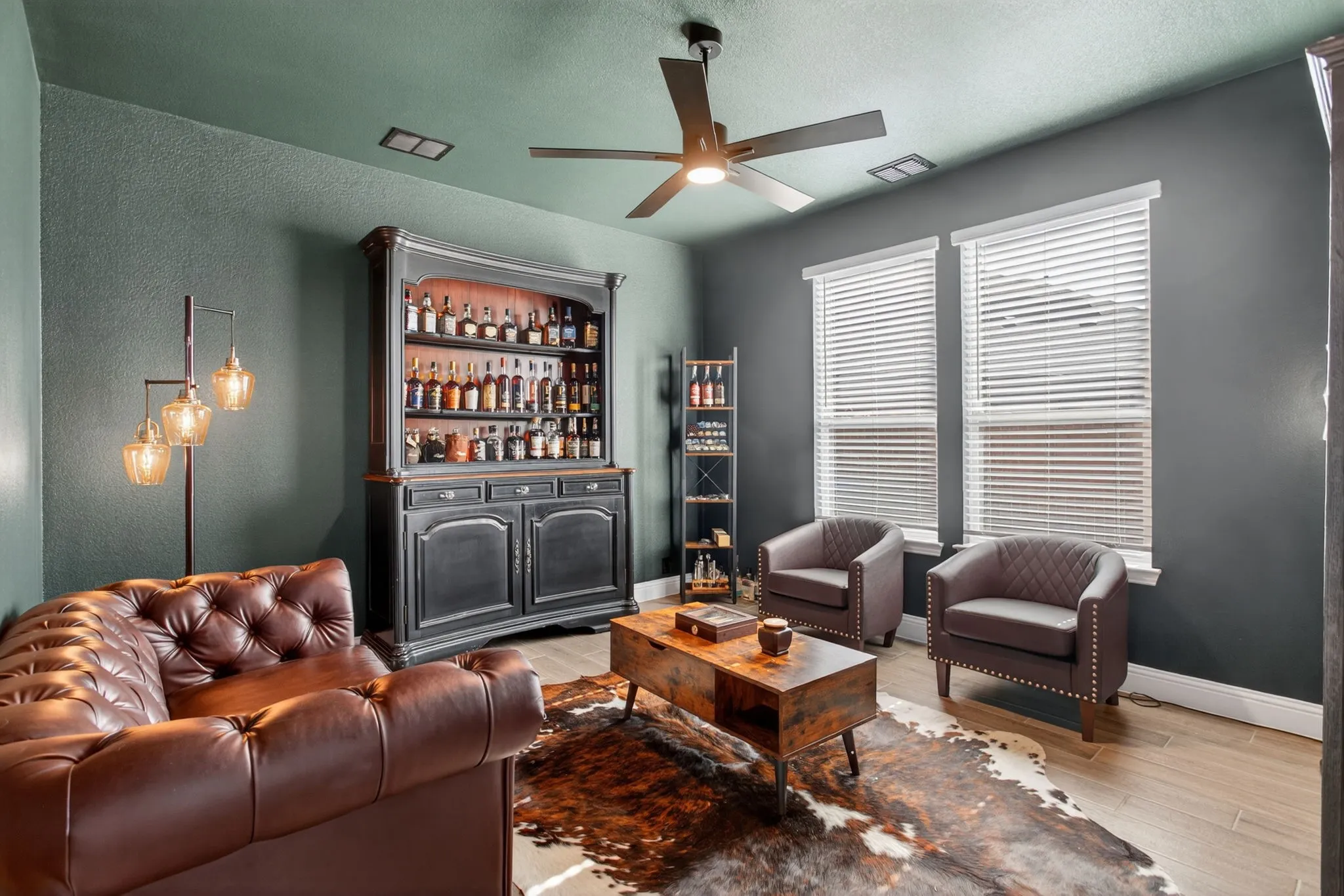 Owners have transformed the office into a fun, moody speakeasy. Whiskey collection does NOT convey! Sorry!