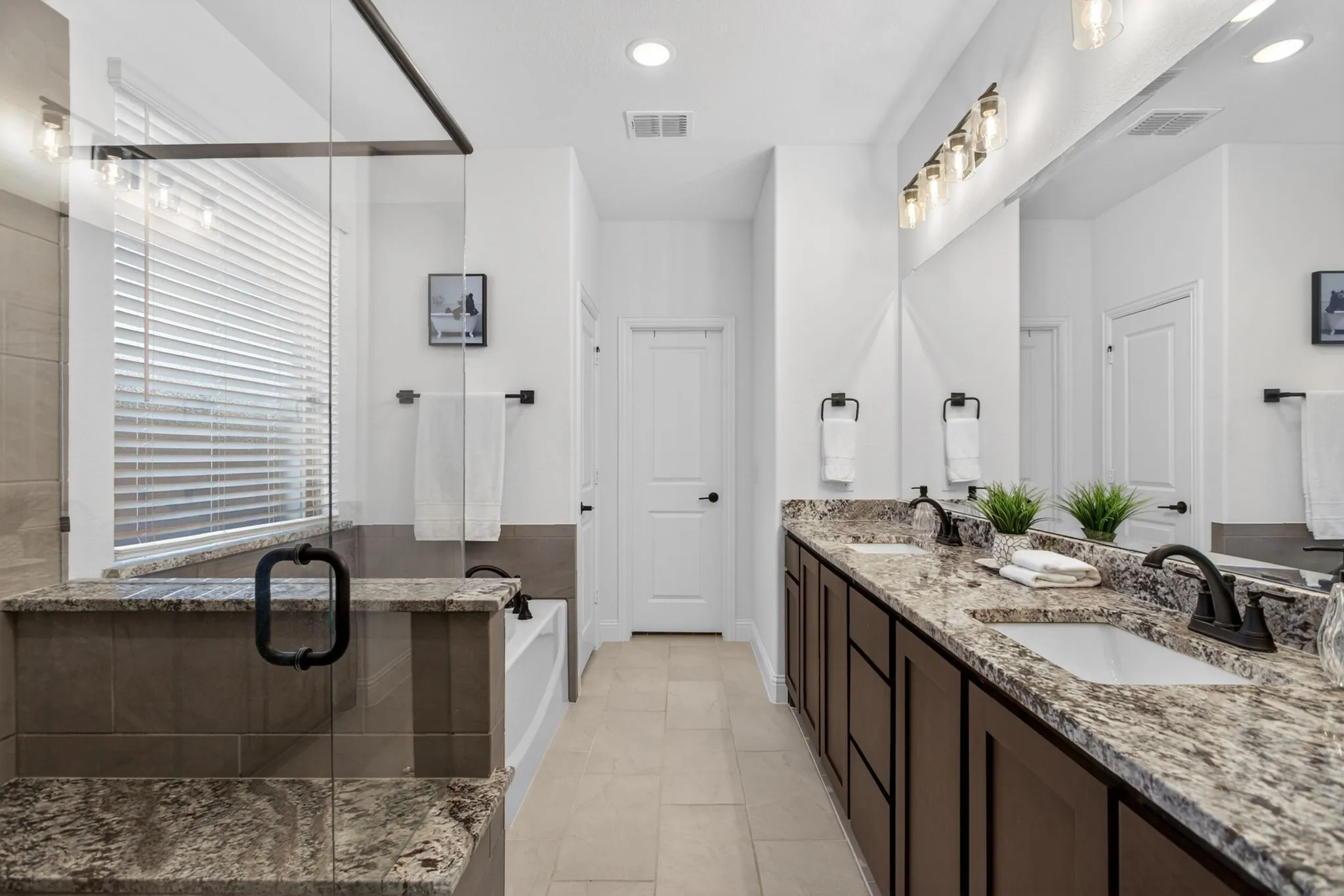 Ensuite bathroom is sitting here checking boxes, too. Dual sinks - tons of storage - big walk-in!