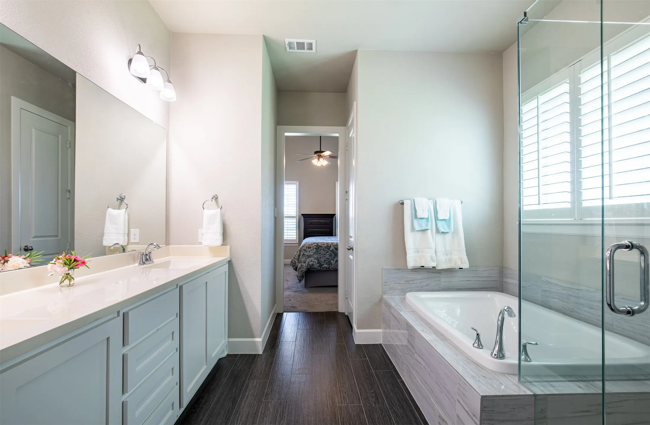 Ensuite primary bathroom with standalone tub.
