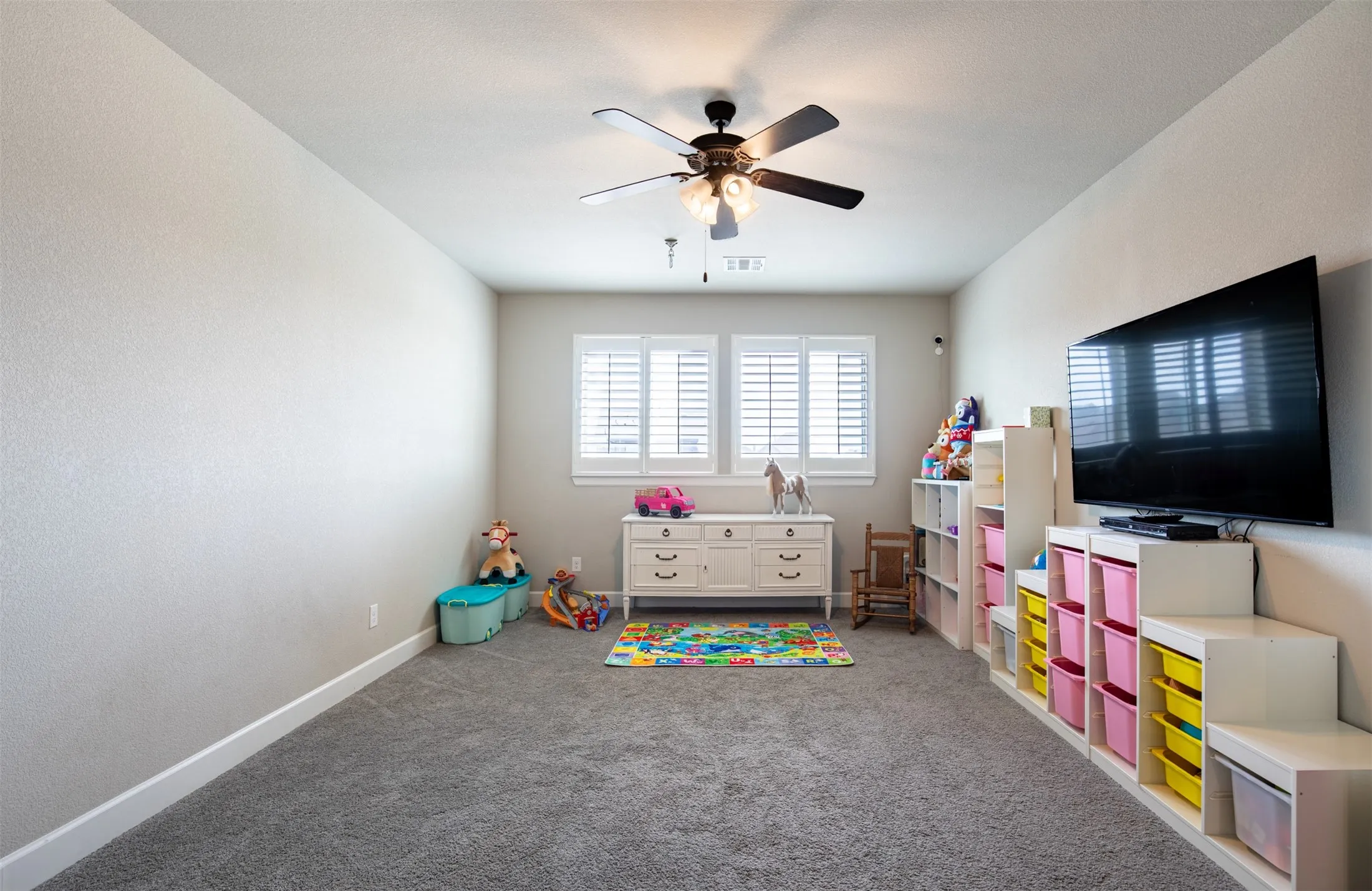 Bonus room can be used as a game room or secondary living area.  Right off of the bonus room is a door to the attic with decking perfect for storing those holiday decorations.