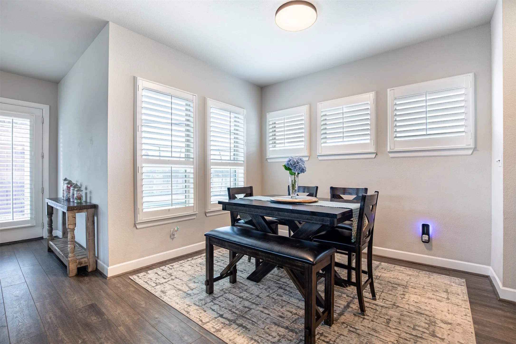 Adjacent to the kitchen, this spacious area provides additional seating and plenty of room for dining or entertaining.