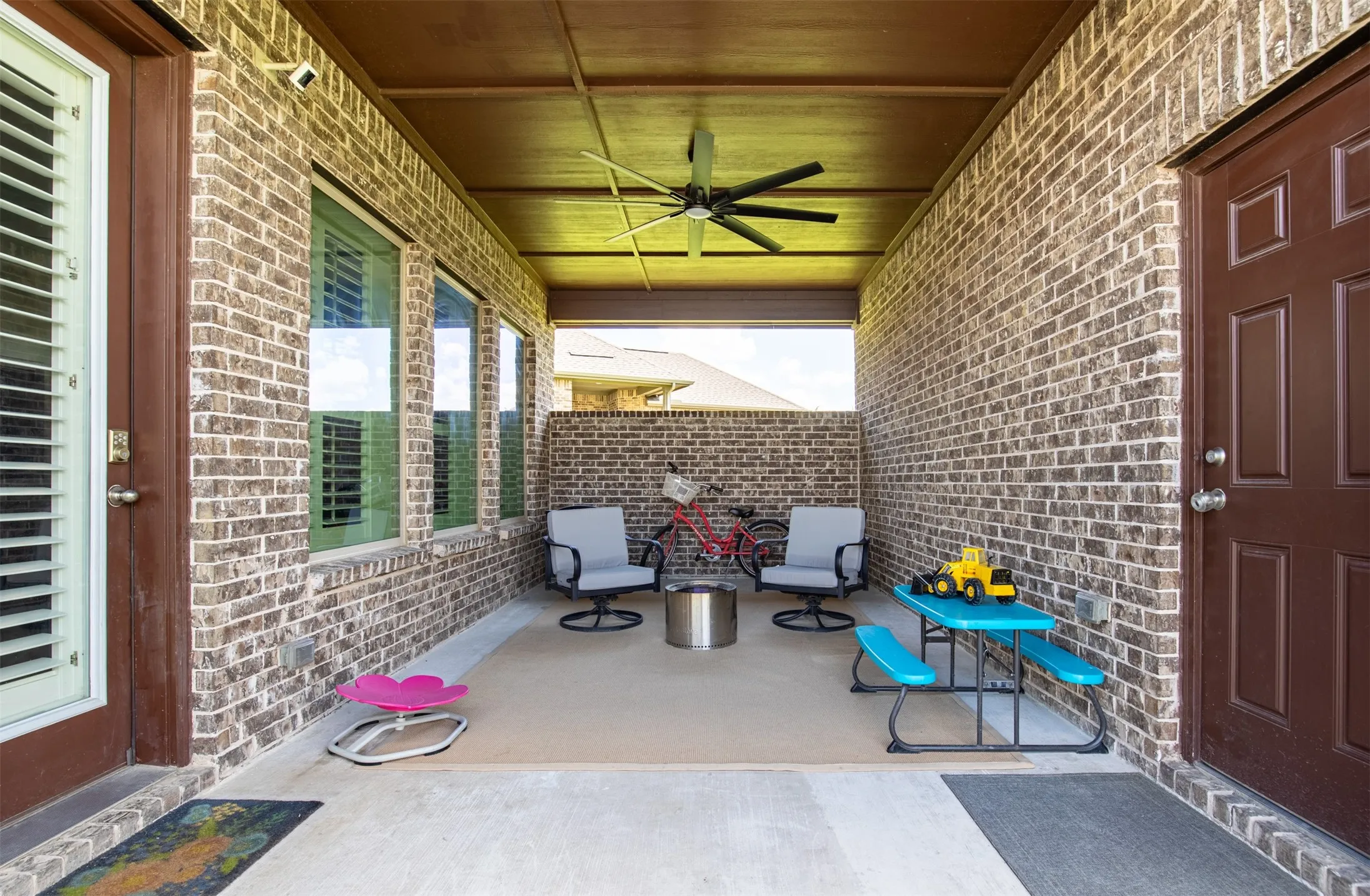 Covered patio is perfect for grilling, watching football, exercising, or just relaxing and watching the kids enjoy the large yard.
