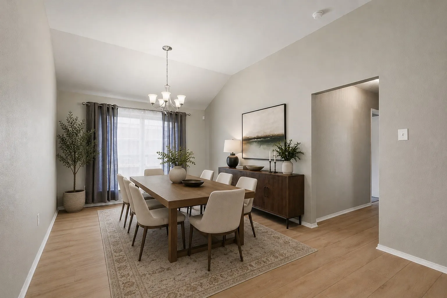 Vaulted ceiling with a chandelier, wood-finish flooring, recessed lighting, and a window with drapery, Virtually Staged.