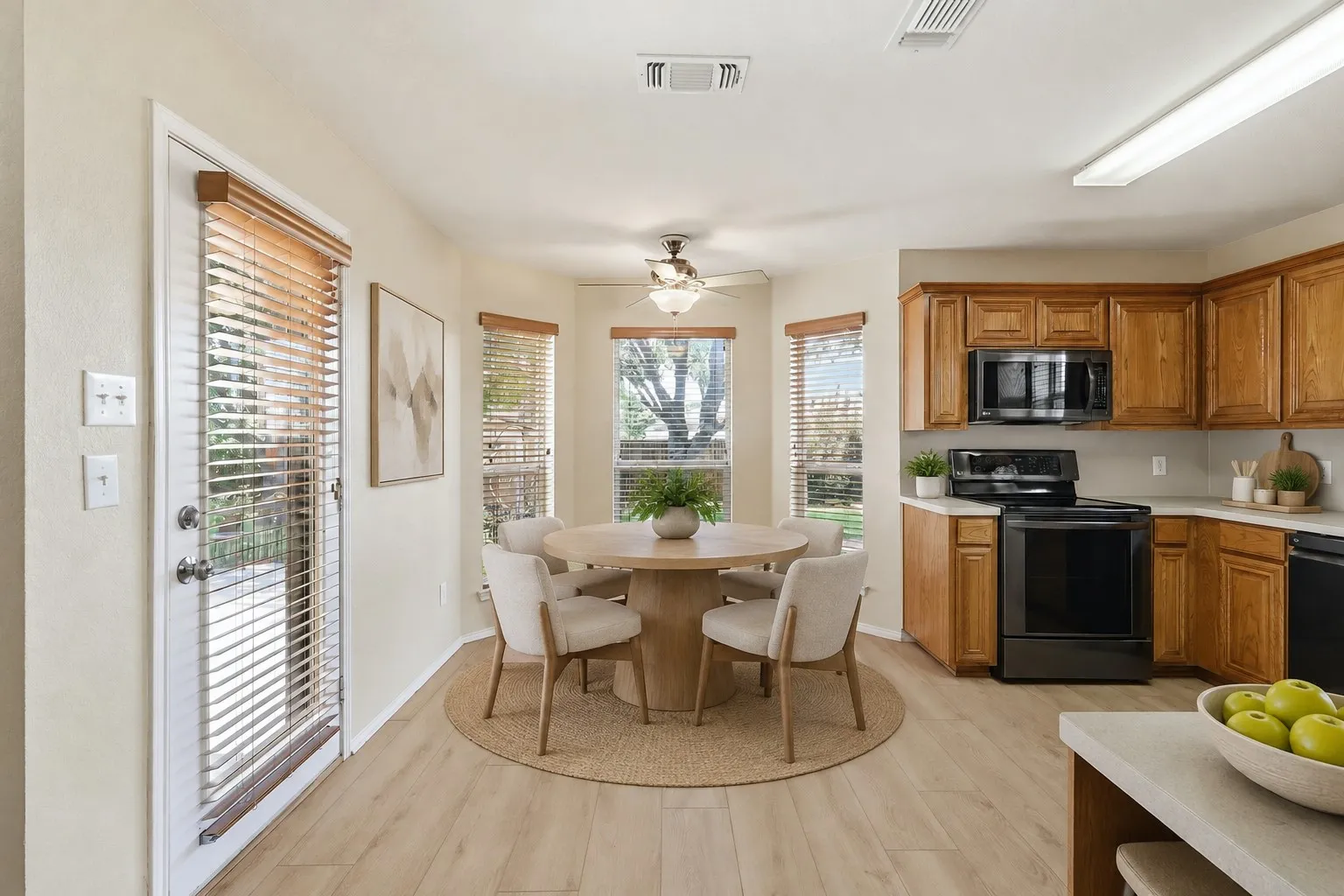 Kitchen and Breakfast nook area. Virtually Staged.