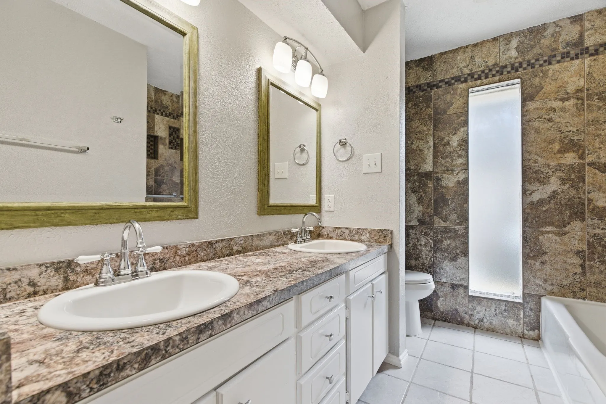 Large vanity area with excellent storage and natural light