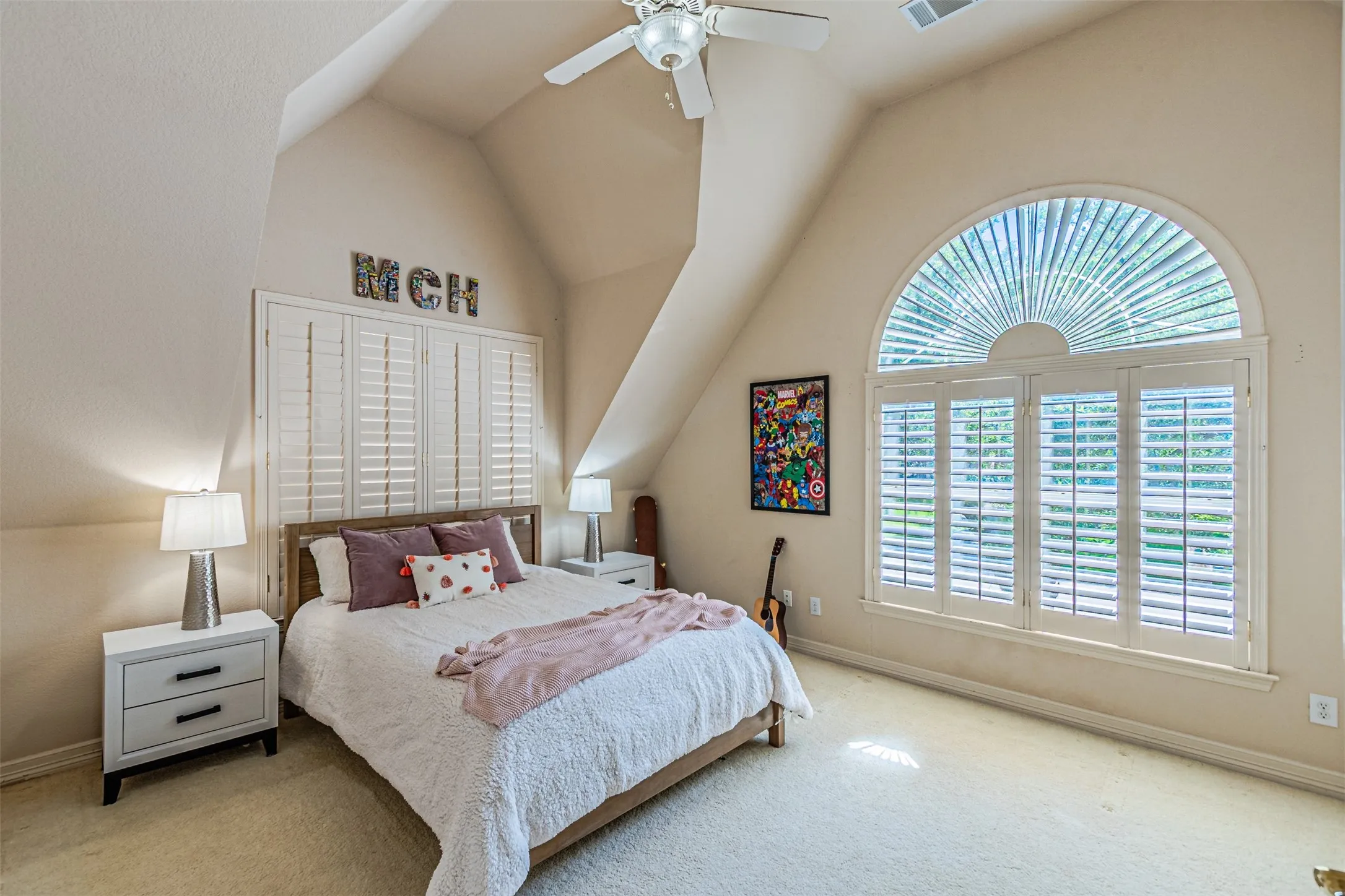 Vaulted ceilings featuring a ceiling fan with light fixture