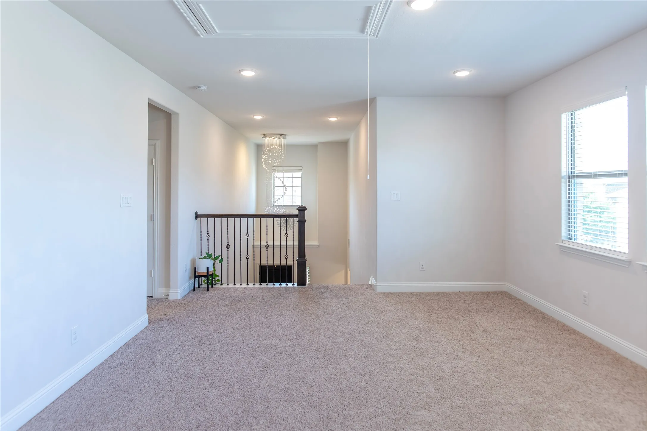 unstaged loft area at the top of the stairs