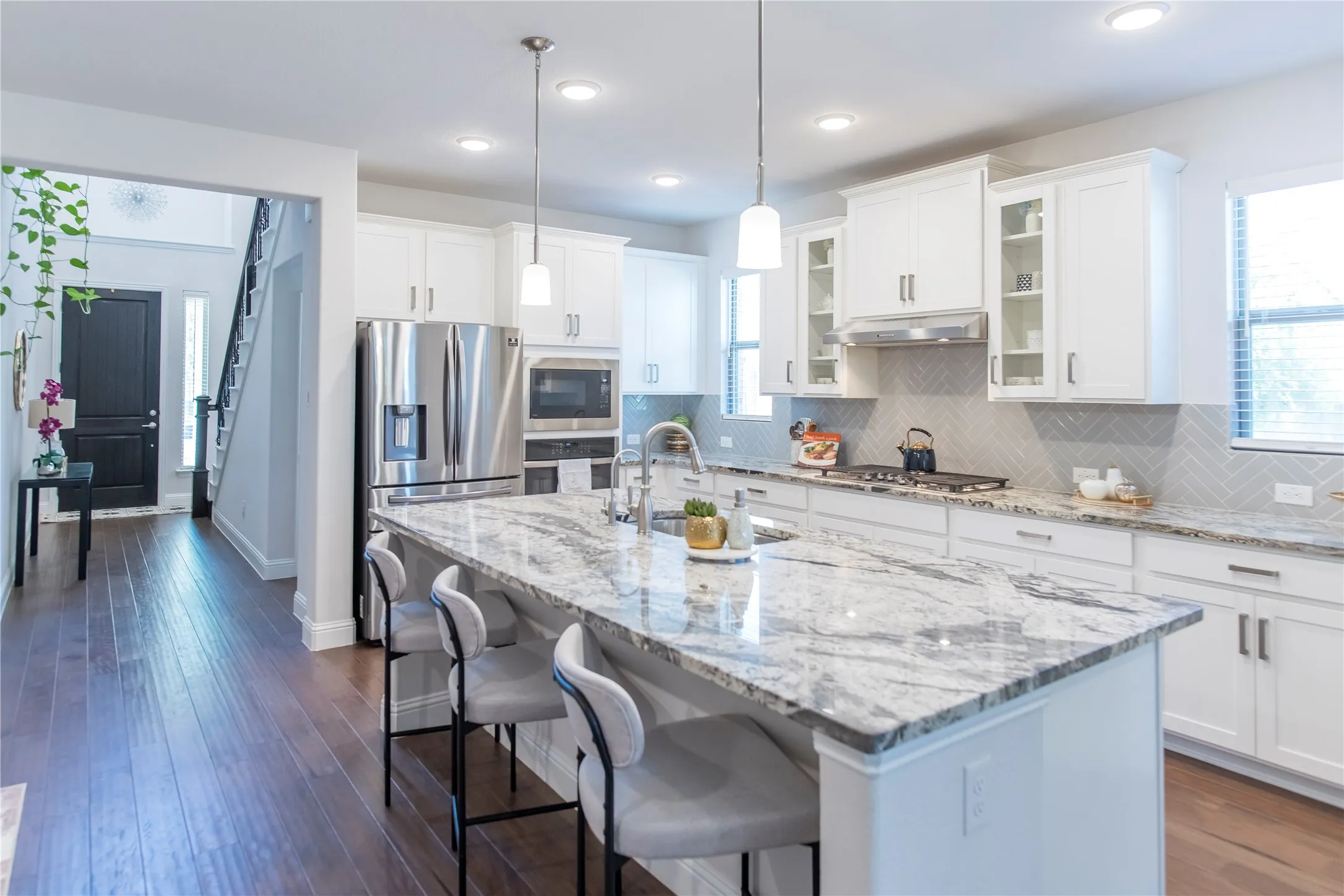 Open spacious kitchen, Glass white cabinetry, with hardware