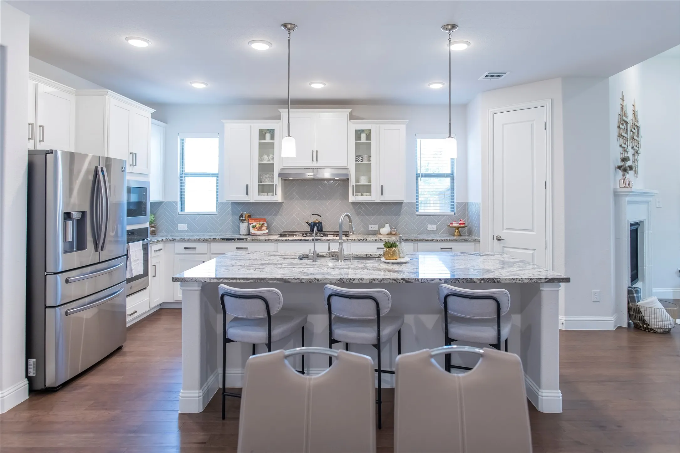 Large island with pendant lighting and large dining area