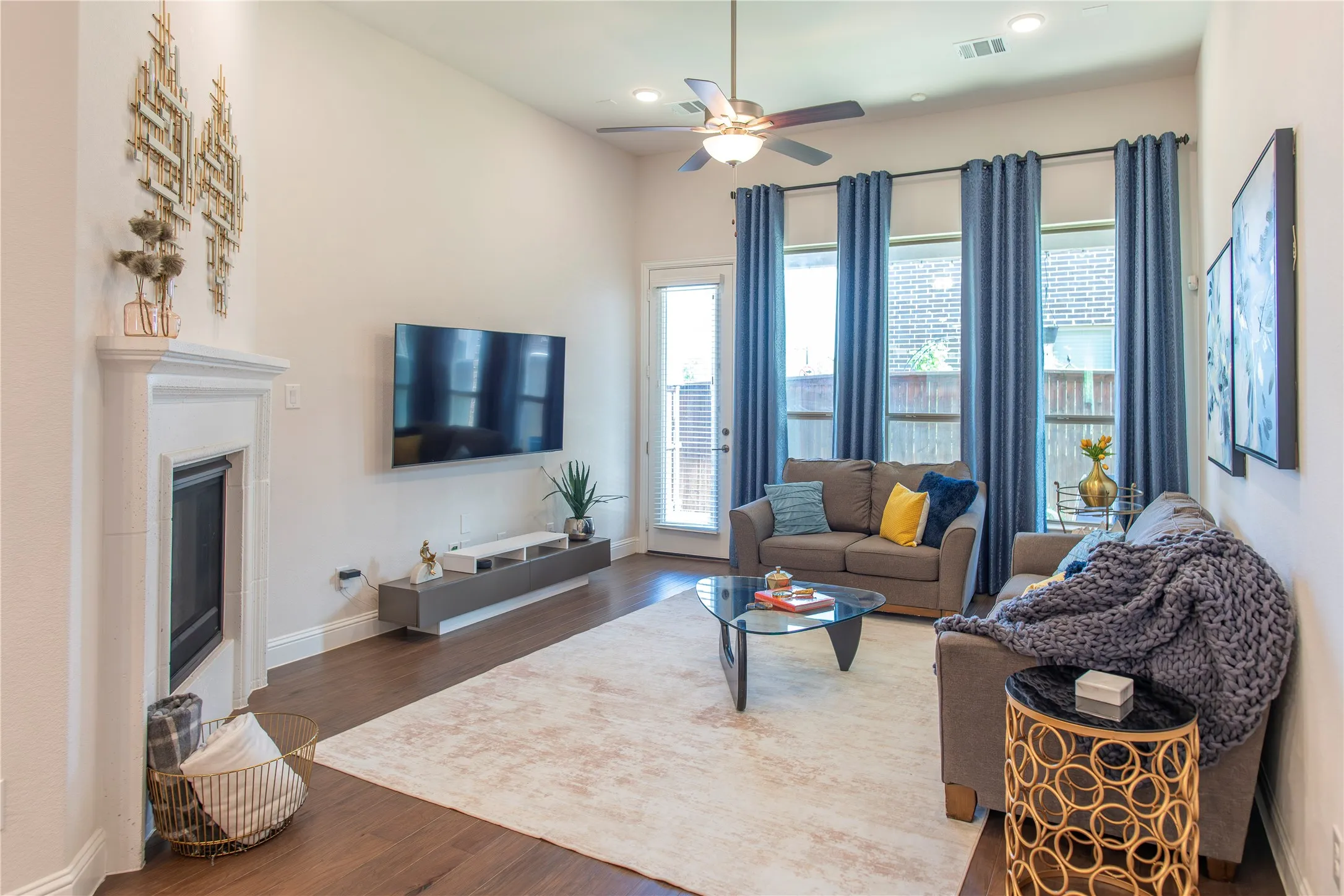 Tall ceilings, cast stone gas fireplace, hardwoods throughout first floor.
