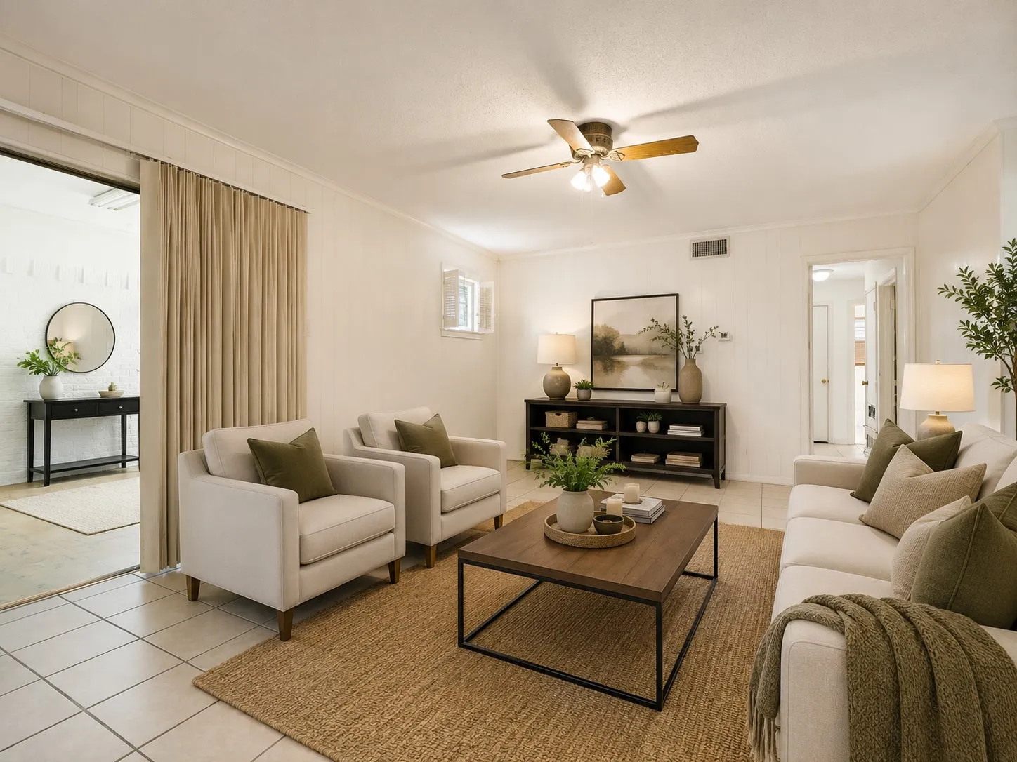 Inviting living area featuring light-toned tile flooring, recessed lighting, and a ceiling fan