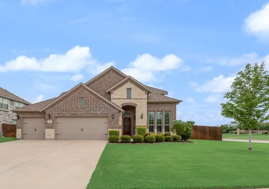 View 2 Exterior -Landscaped and Professional Maintained Corner Lot, Perimeter Fencing 12 Zone Sprinkler System.