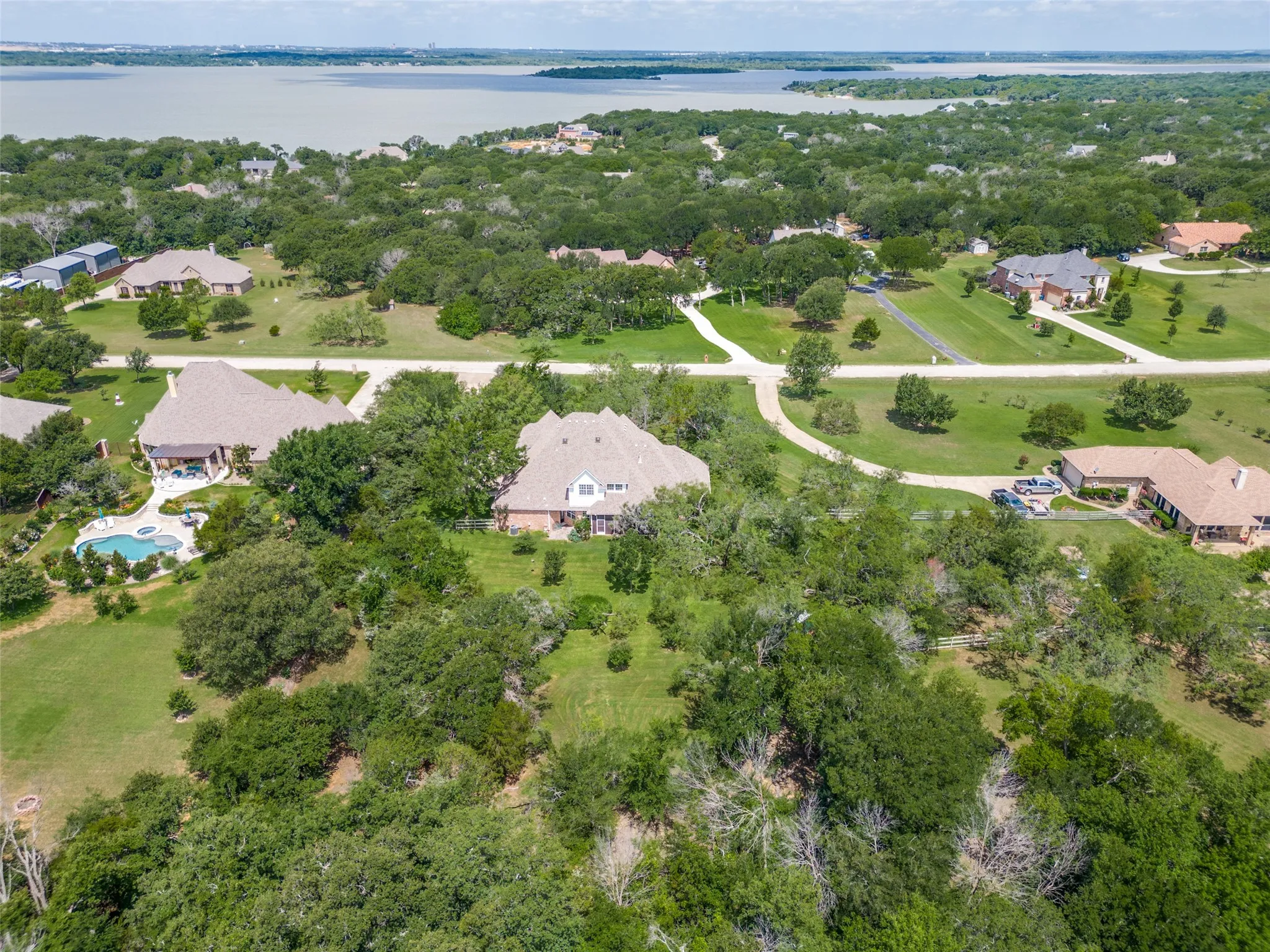 View of the home in the middle and Lake Lewisville in the background.  You can see how close to the lake you are.
