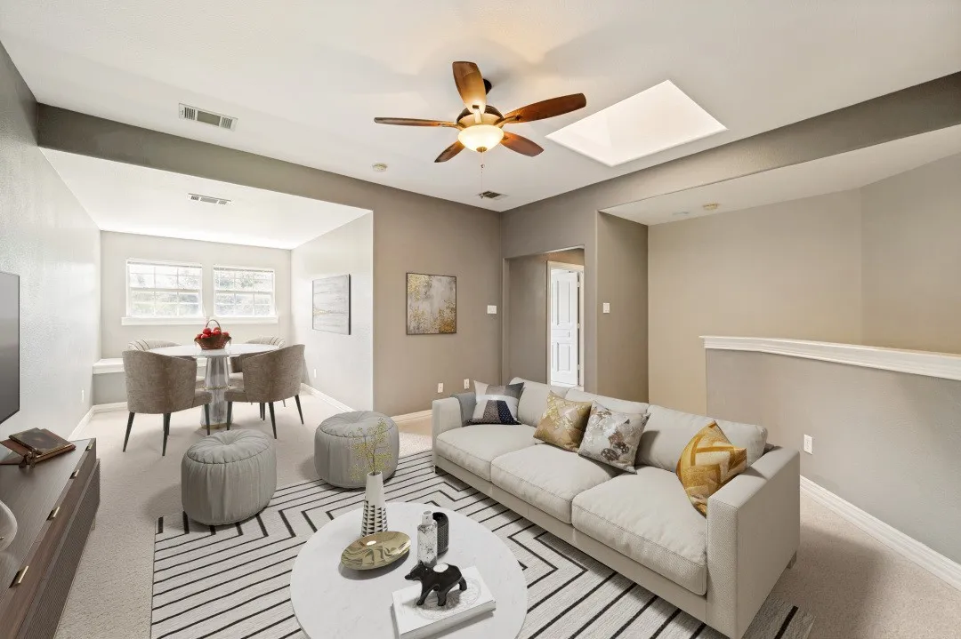 Virtually staged upstairs living area with game table and TV area