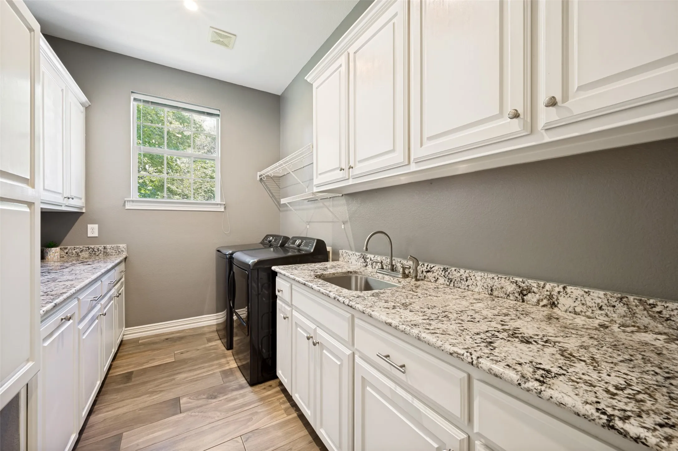 Oversized laundry with space for storage, space for folding,space for washer,/ dryer.