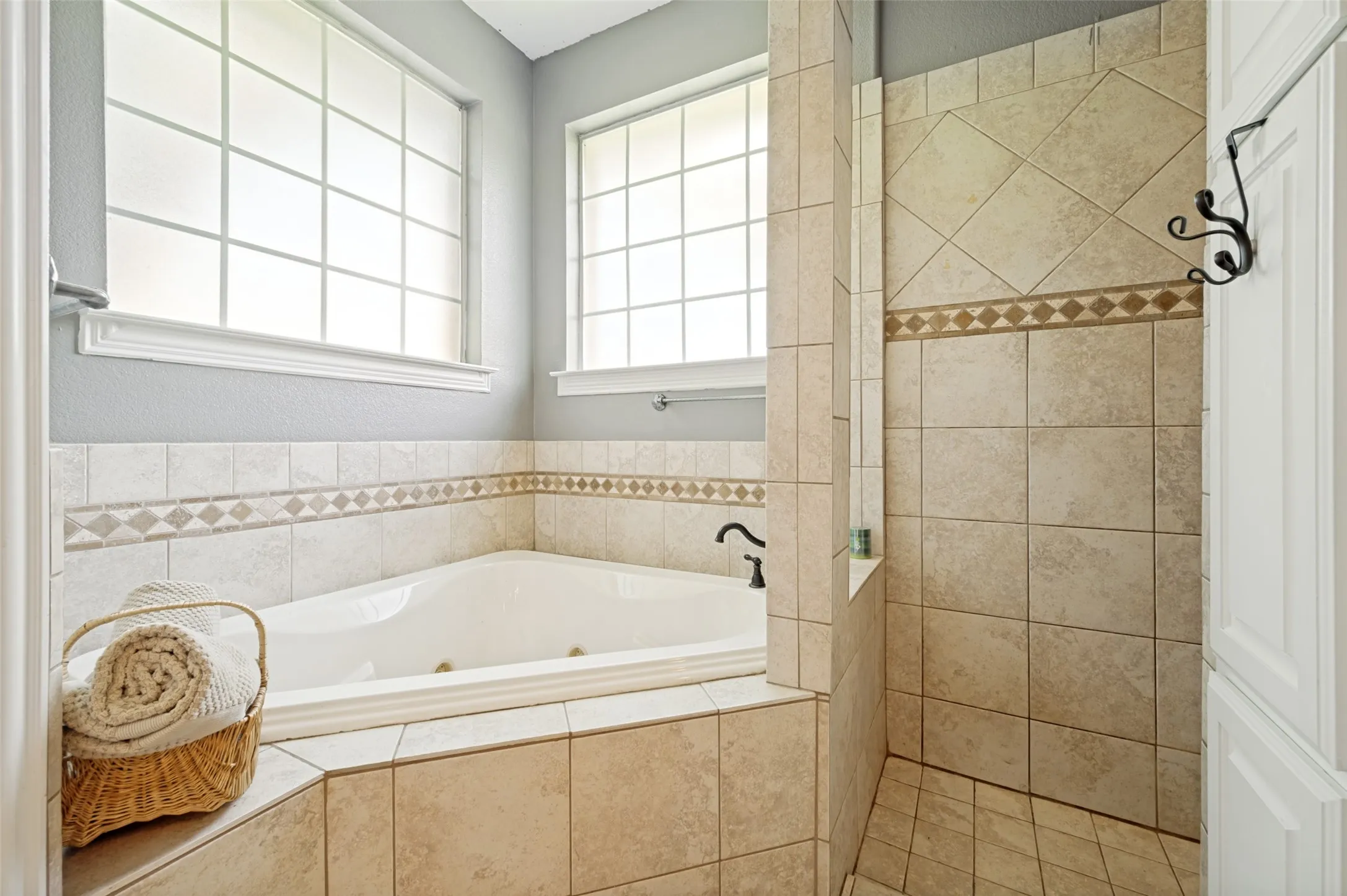 Primary bath walk in double shower and soaking tub
