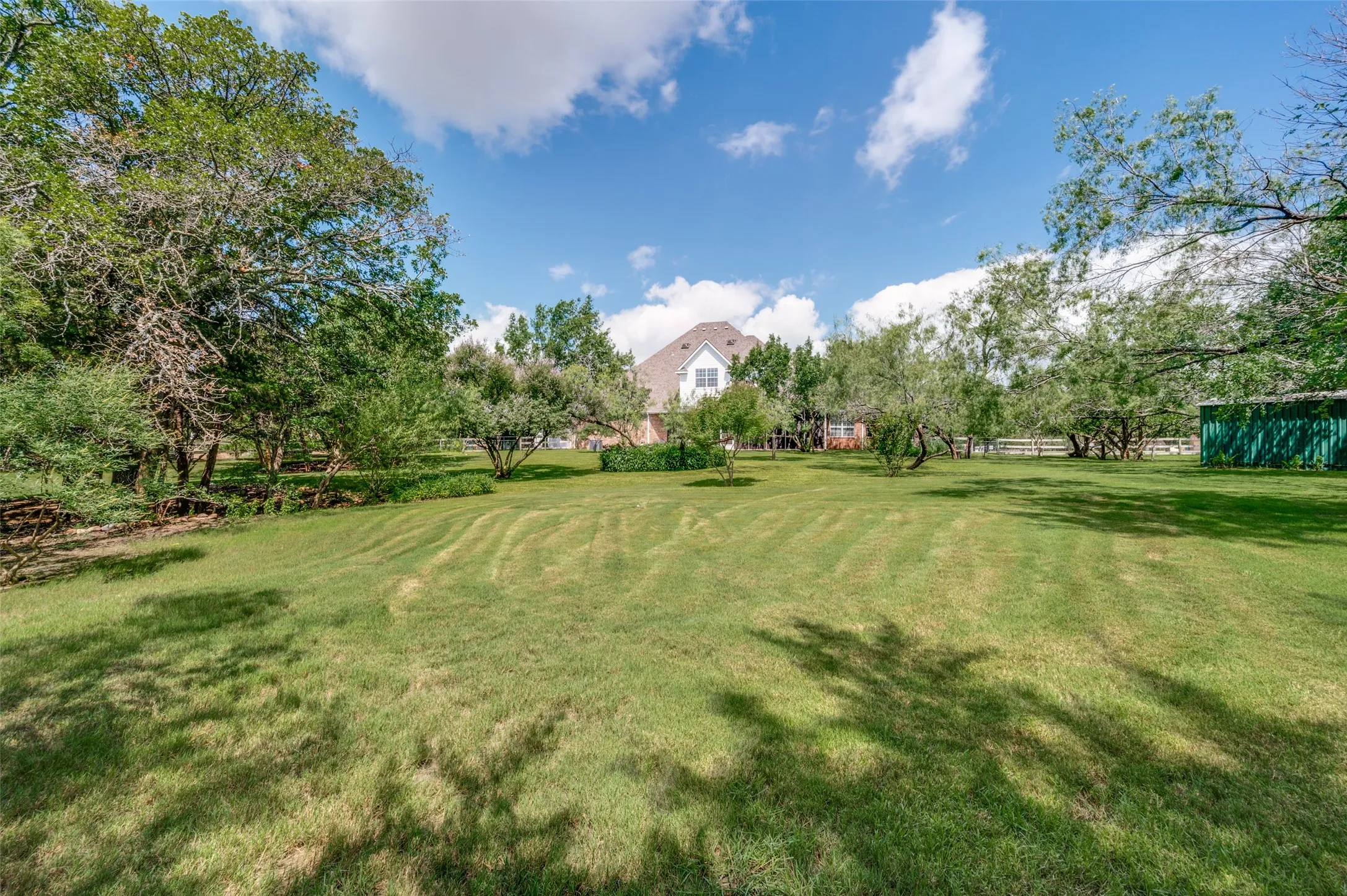 View of the back of the home from way out on the property