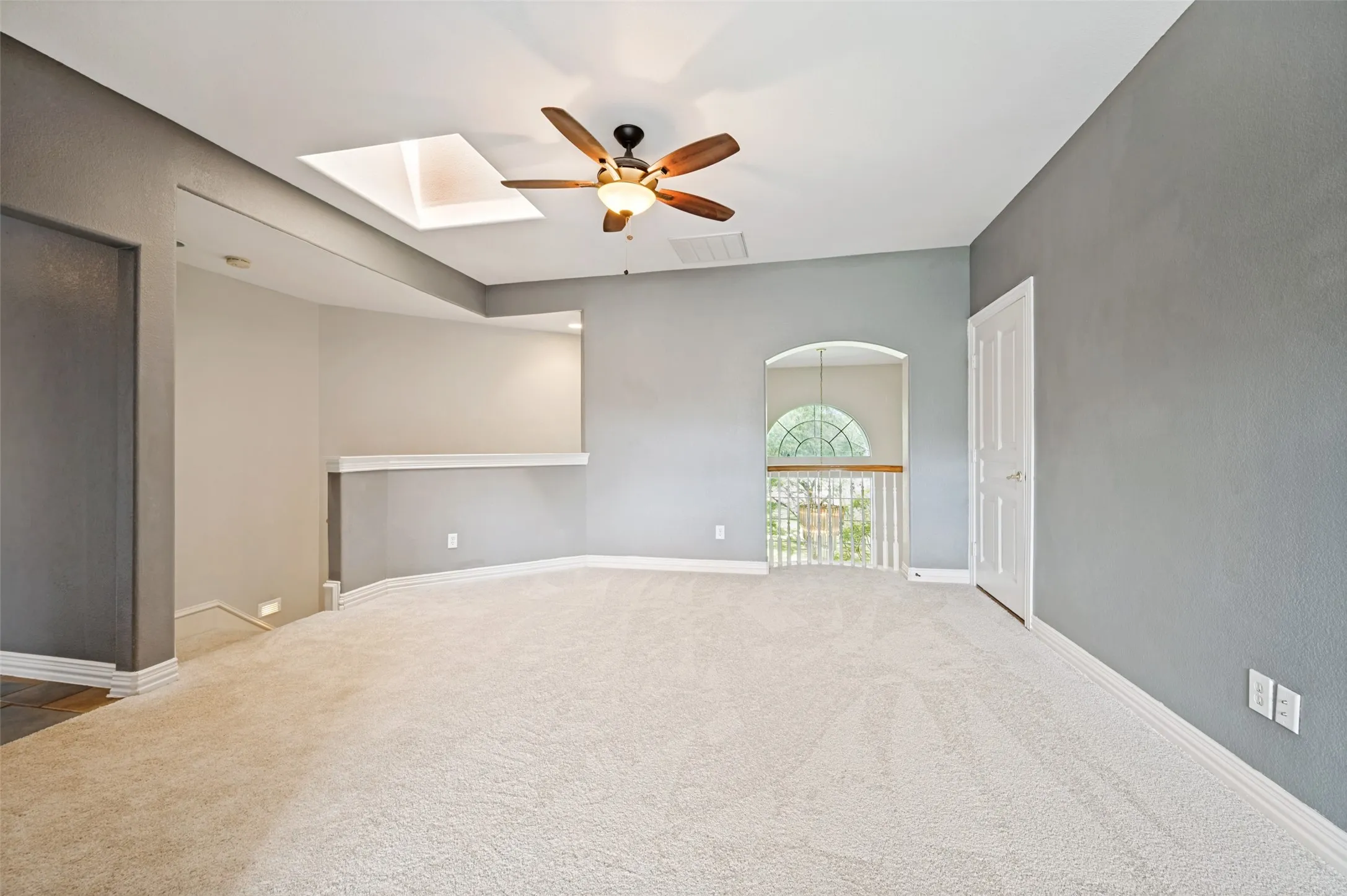 View of upstairs living area looking towards Juliet balcony