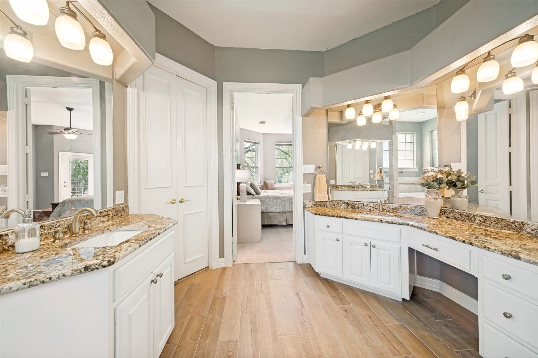 Primary bath has walk in shower, separate soaking tub, separate vanities with sinks